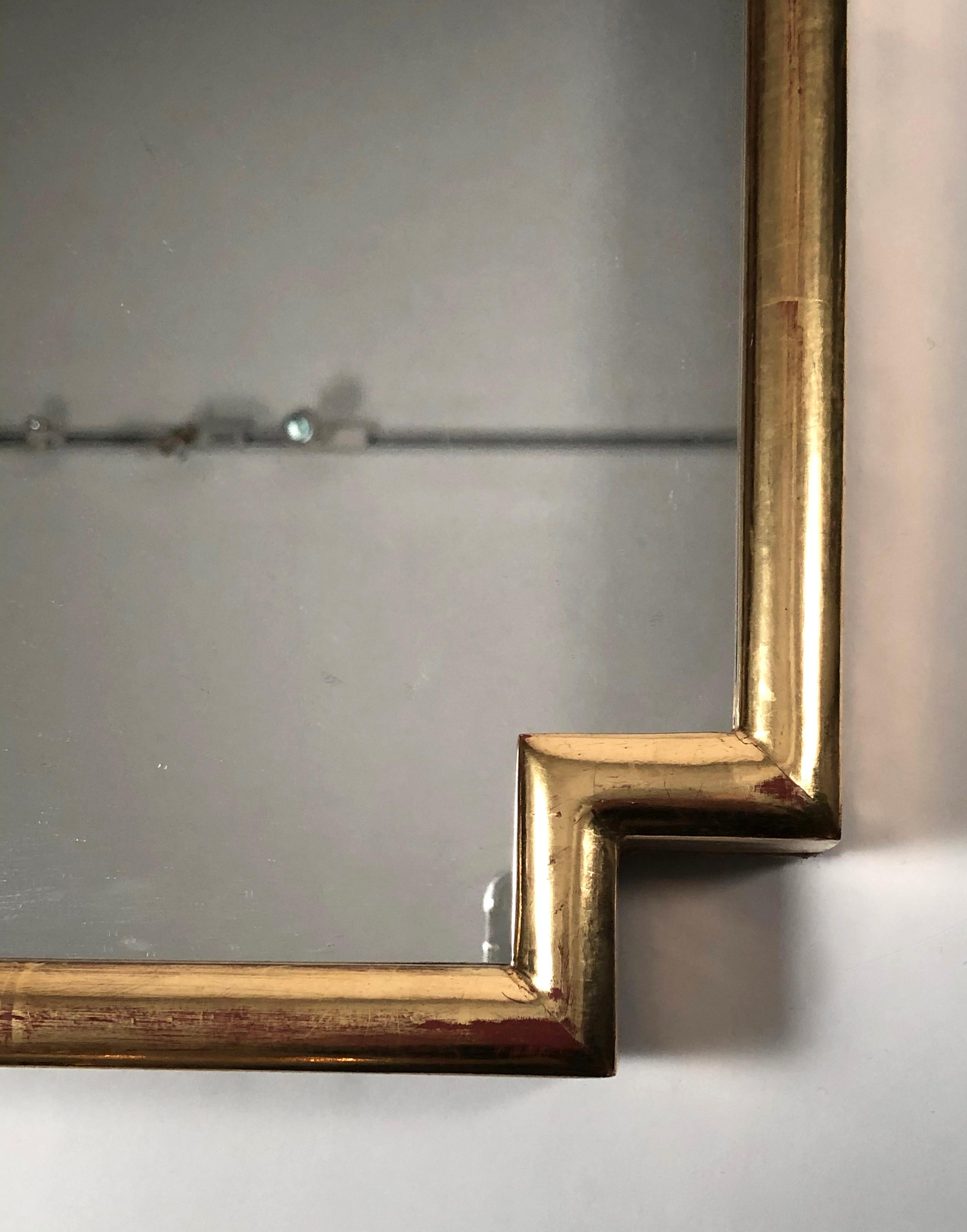 Pair of Tommi Parzinger Brass Sconces Together with Giltwood Mirror 1