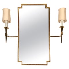 Pair of Tommi Parzinger Brass Sconces Together with Giltwood Mirror