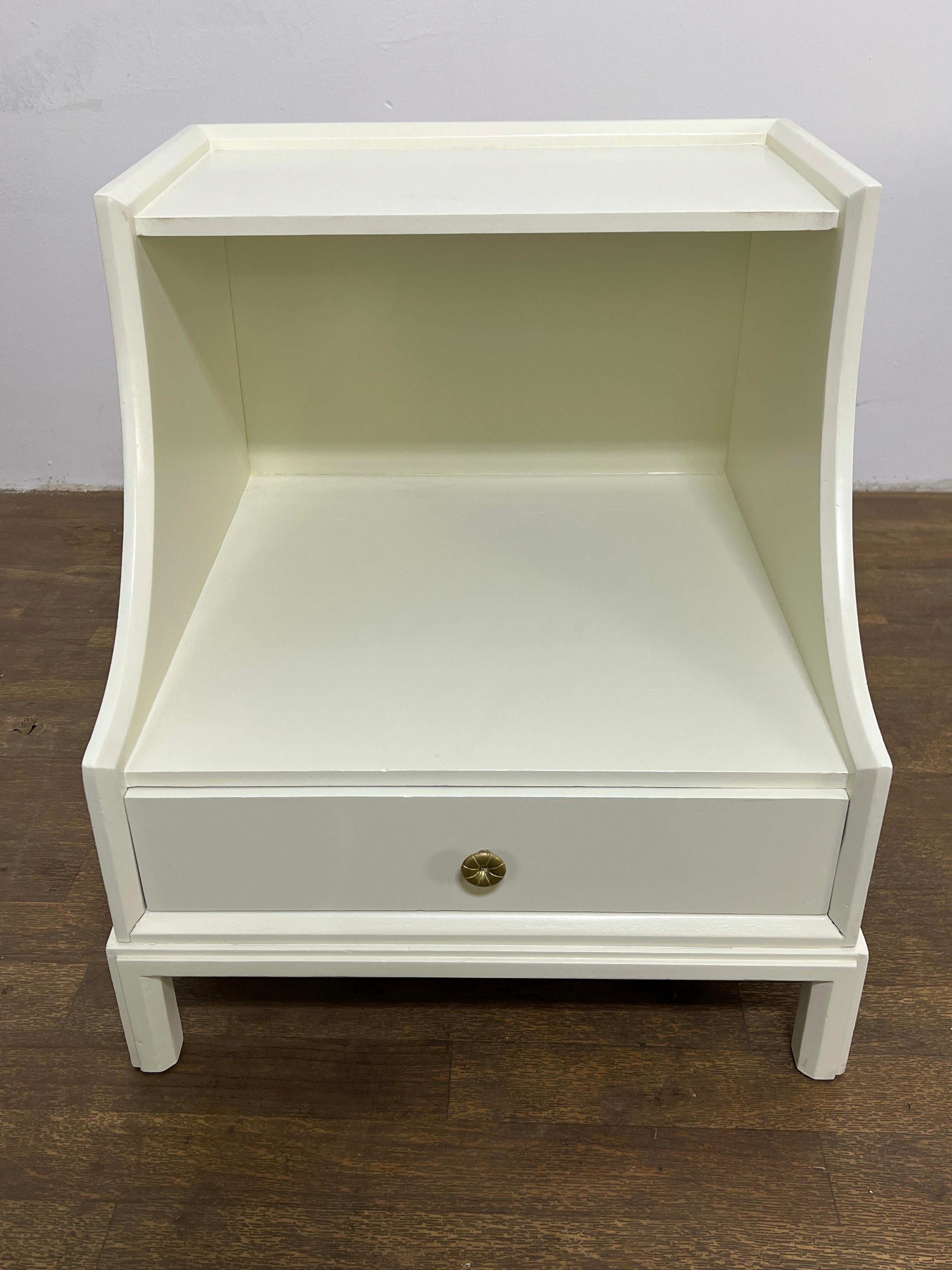 Pair of scoop front nightstands by Tommi Parzinger for Charak Modern, circa 1950s.