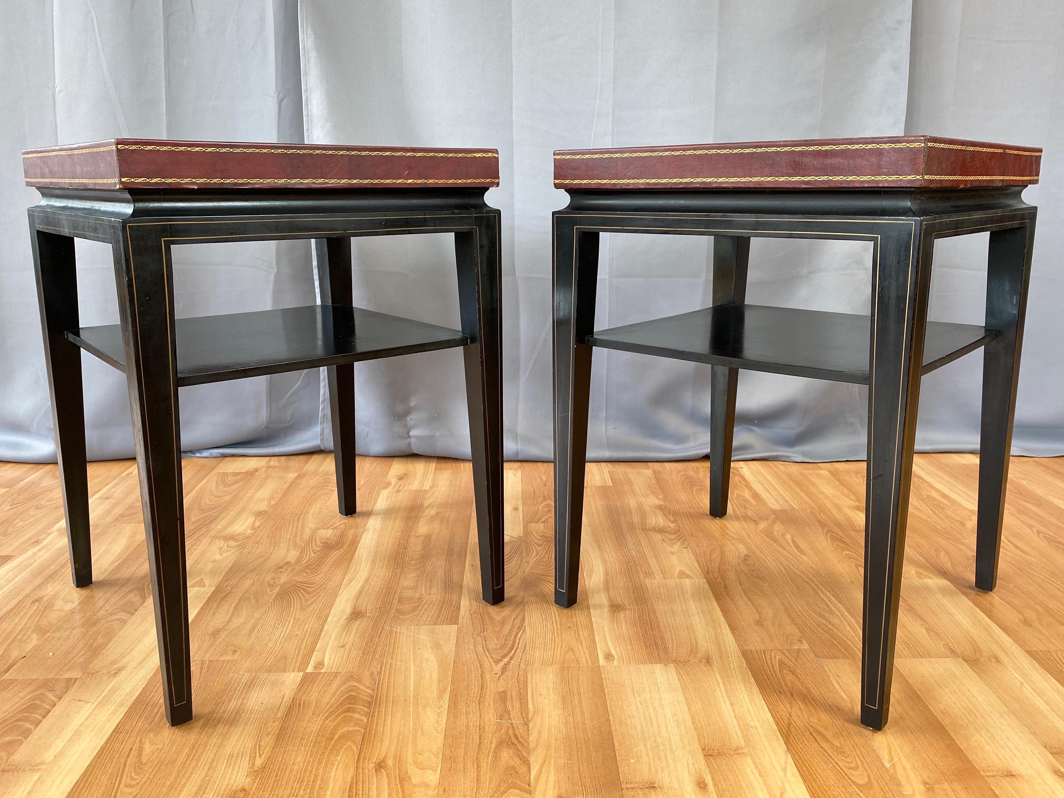 A pair of rare c. 1955 model 3303 occasional or end tables with leather top and ebonized mahogany frame by Tommi Parzinger for Charak Modern.

Exceptionally handsome Hollywood Regency design distinguished by a two-inch-tall leather-clad top with