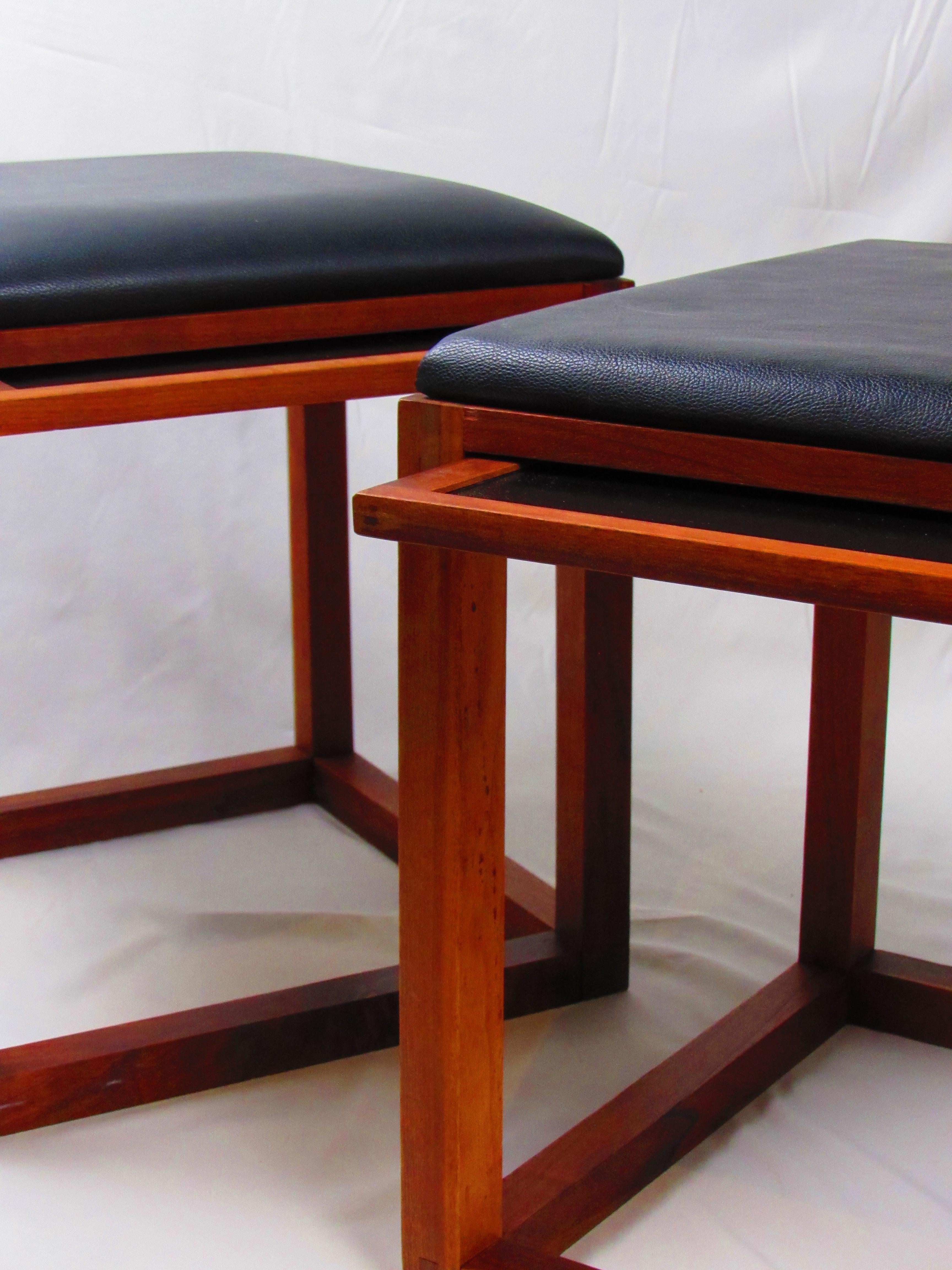 This pair of Tony Paul BOC ottomans offers the perfect combination of Mid-Century Modern design and practical functionality. Each ottoman features a solid walnut wood frame with clean, sleek lines that reflect the iconic style of the era. The