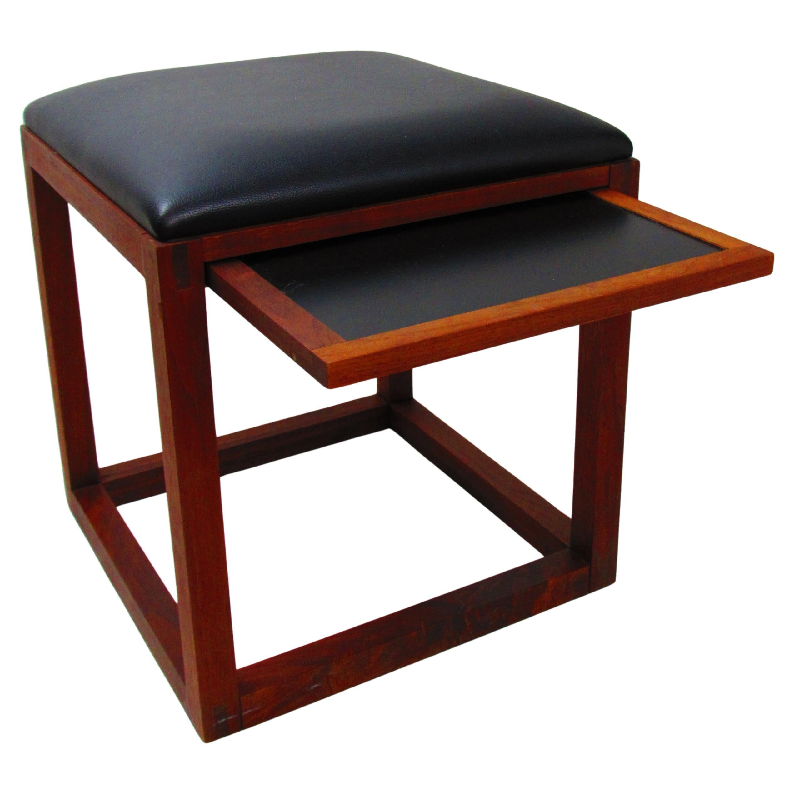 Pair of walnut ottomans with pull-out trays, Tony Paul BOC