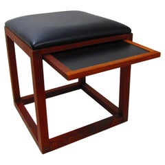 Pair of walnut ottomans with pull-out trays, Tony Paul BOC