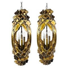 Pair of Torch Cut Brass Brutalist Chandeliers by Tom Greene for Feldman