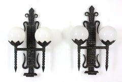 Pair of Torch Wall Lights in Wrought Iron with Milk Glass Globes, 1940s