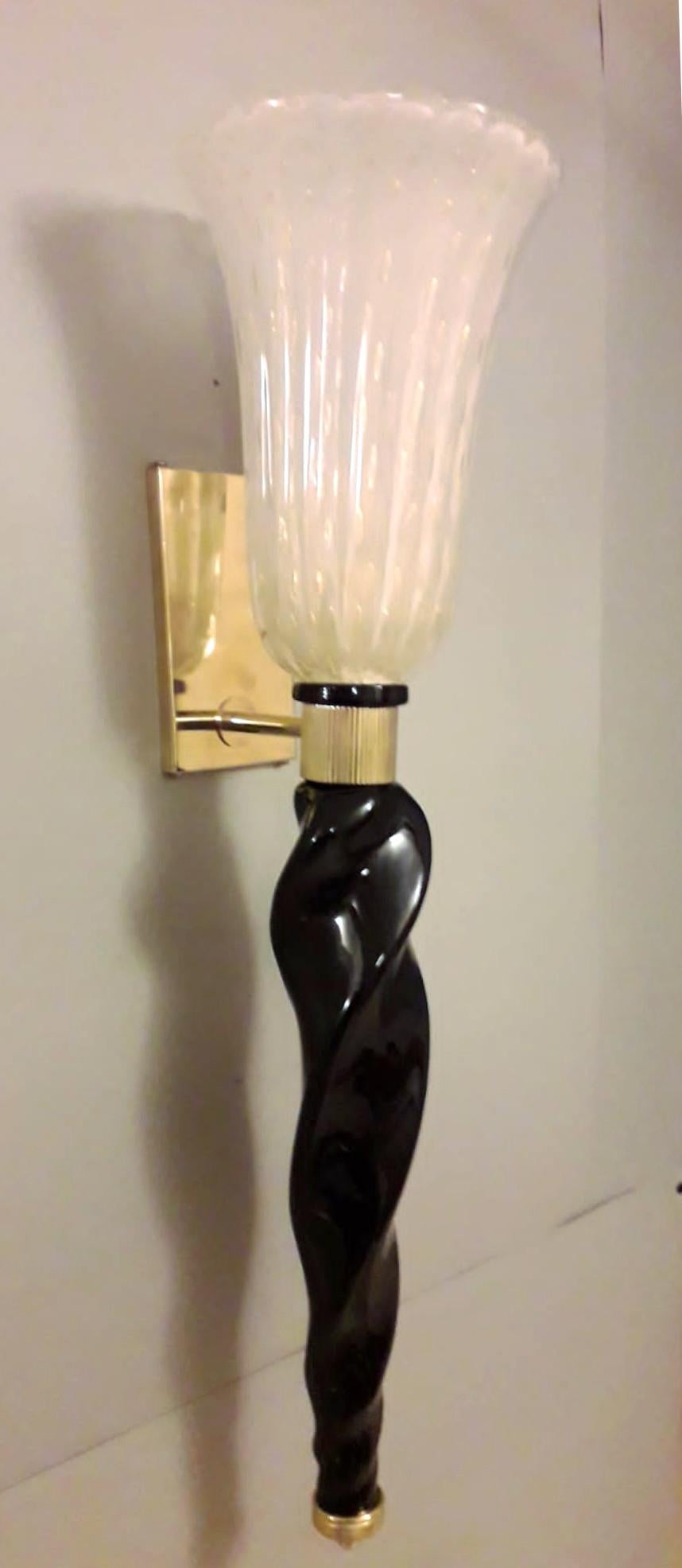 Italian torchere wall sconces with hand blown frosted white Murano glass shades infused with gold and twisted black Murano glass stem, mounted on brass frames / Made in Italy
1 light / E26 or E27 type / max 60W
Measures: height 29 inches, width 7.5