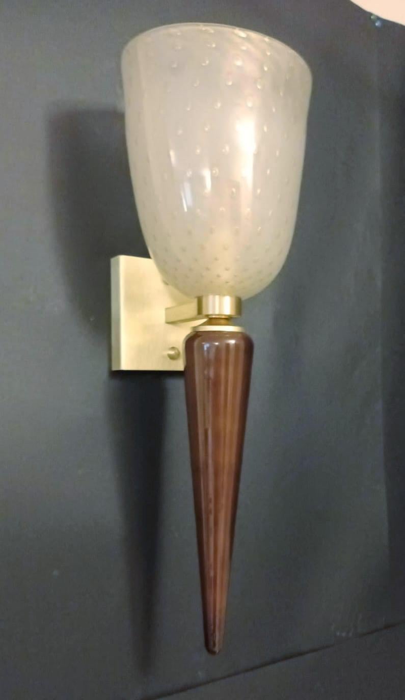 Italian torchere wall sconces with hand blown frosted white Murano glass shades infused with gold and brown Murano glass stem, mounted on brass frames / Made in Italy
1 light / E26 or E27 type / max 60W.
Measures: height 24.5 inches, width 8