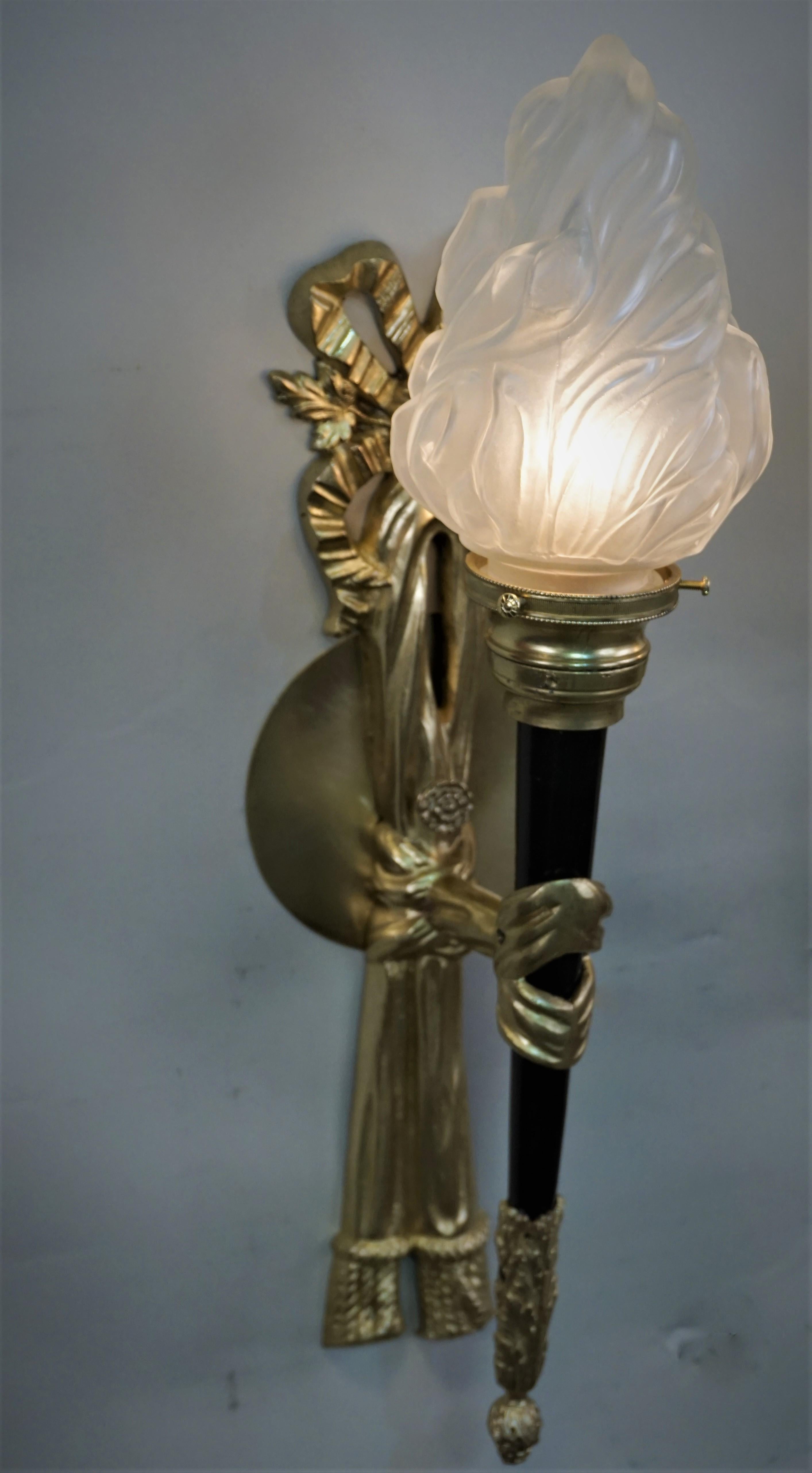 Pair of French bronze empire style torchiere wall sconces.