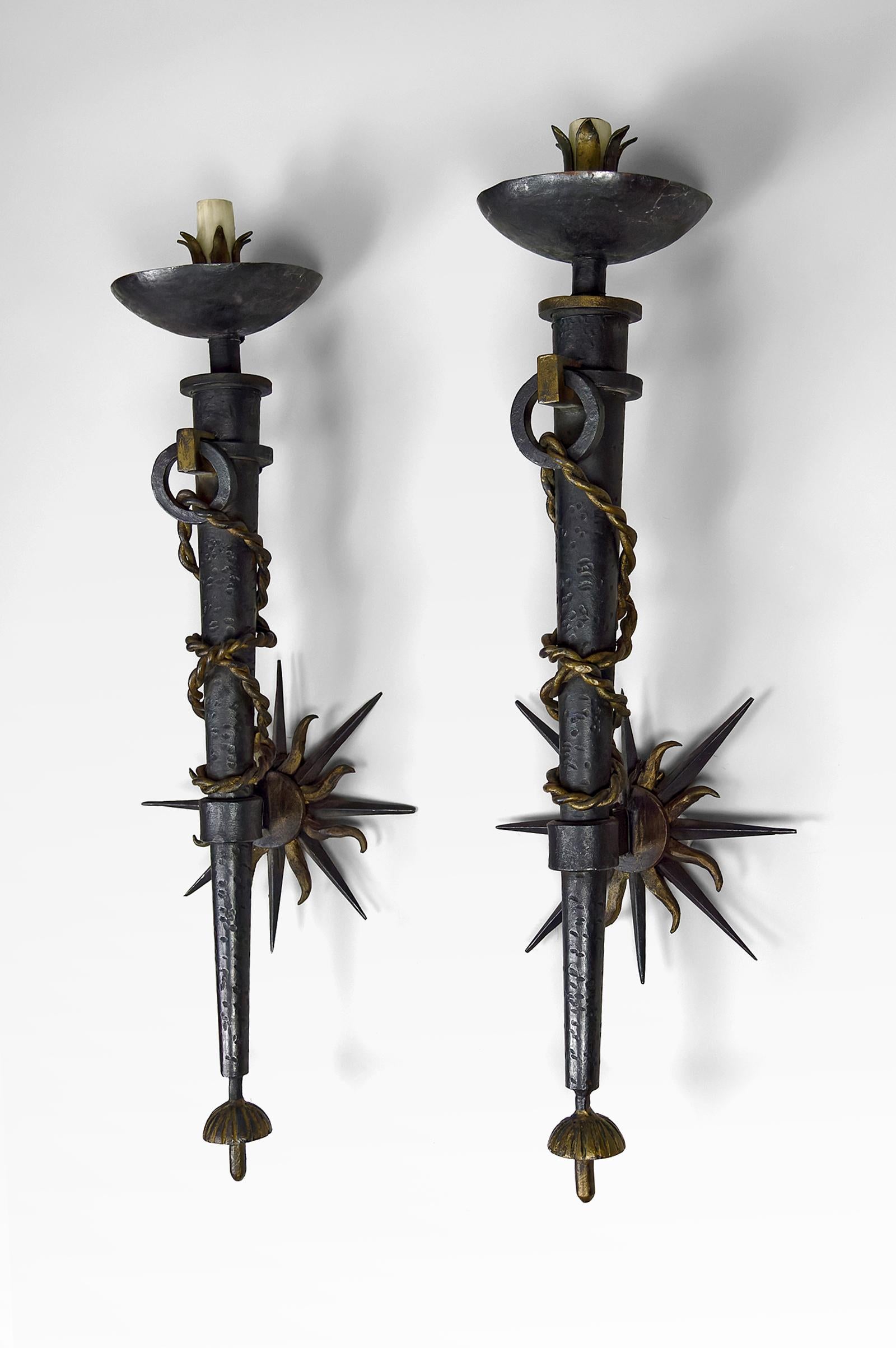 French Pair of torchiere sconces in wrought iron by Gilbert Poillerat, France, 1940's For Sale