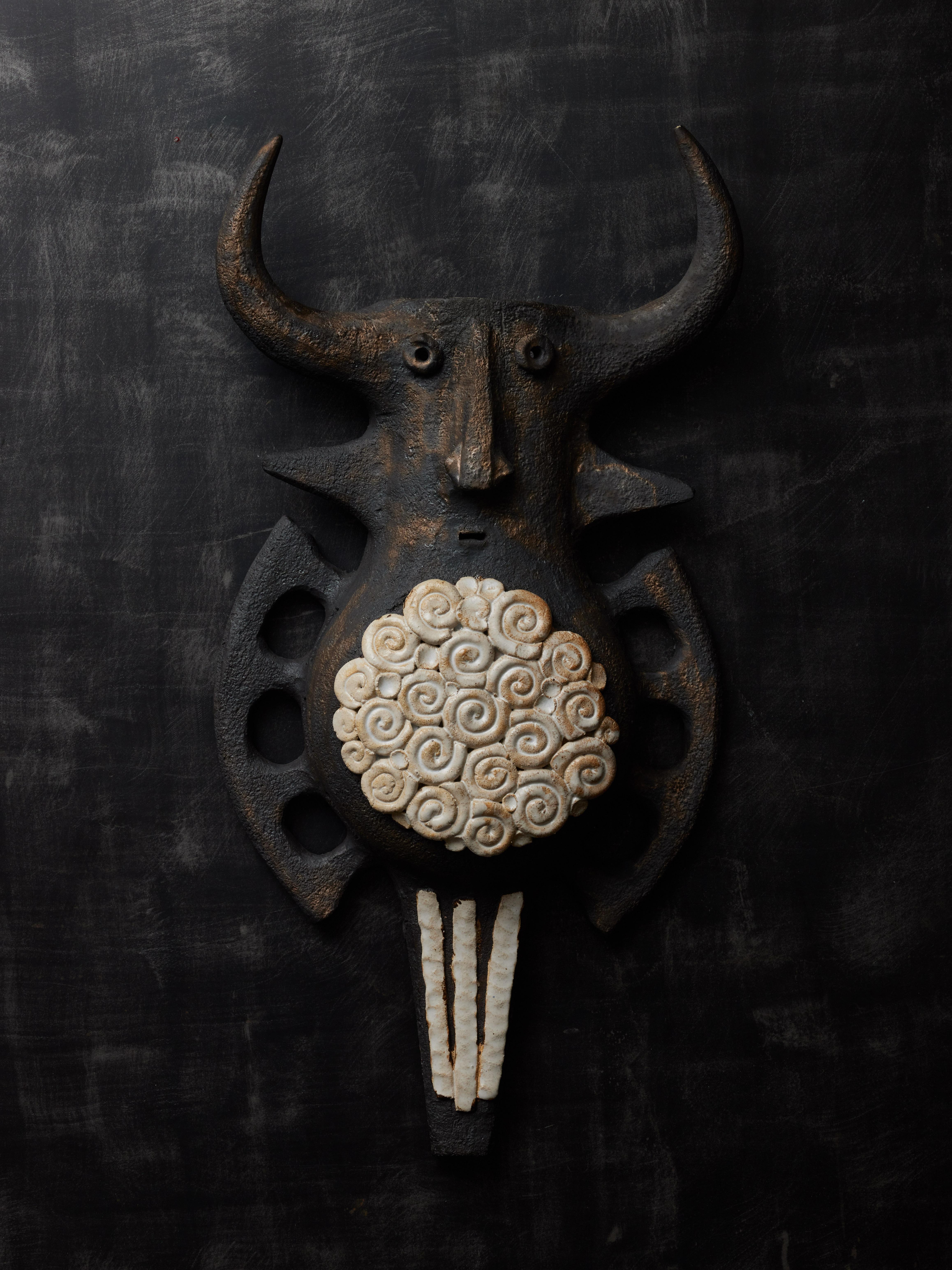 Beautiful example of the French ceramic artist Dominic Pouchain, this pair of Toro wall sconces in dark ceramic with white accent representing an imaginary animal inspired by a bull.
Both pieces are signed

Dominique Pouchain – Born in