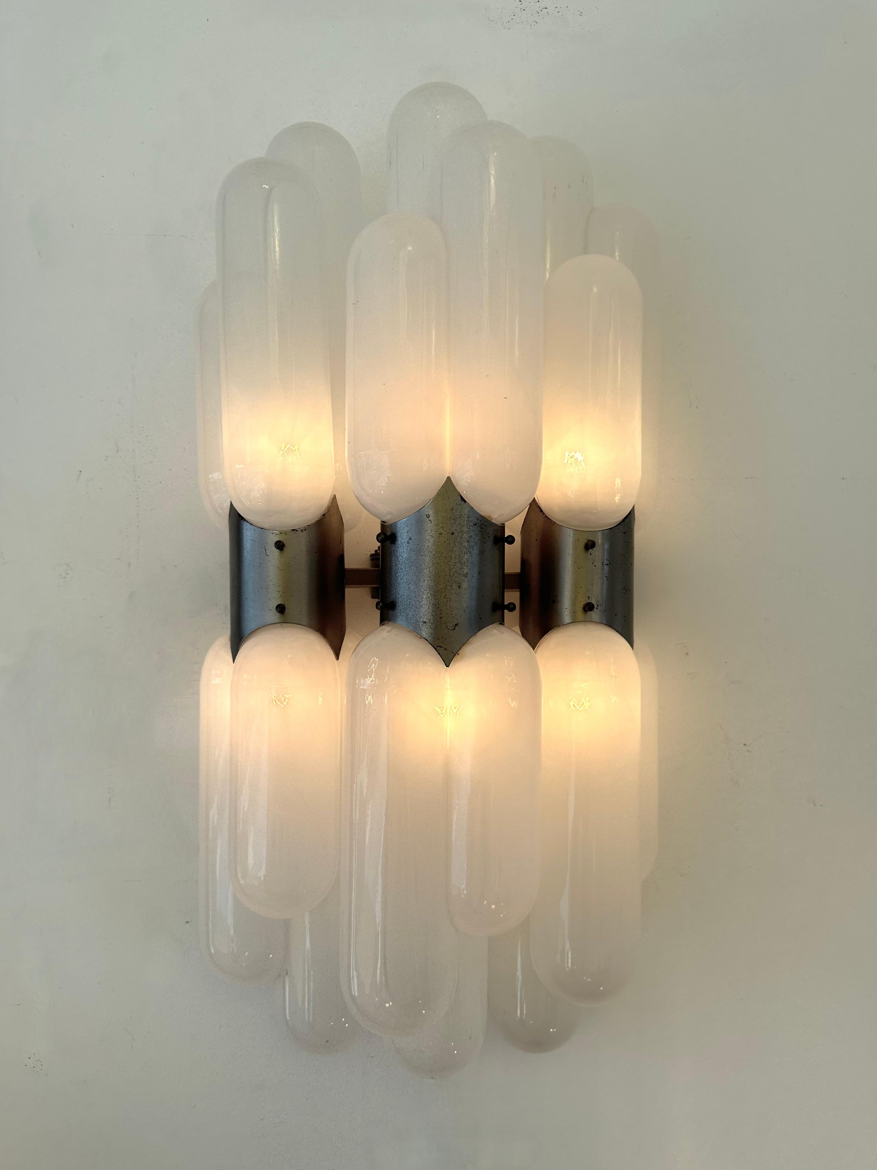 Very rare Mid-Century Modern Space Age Pair of triple model gellule torpedo wall lamps lights lightning sconces by Carlo Nason for the manufacture Mazzega, blown white smoke Murano glass, silver metal structure. Famous manufacture like Venini,