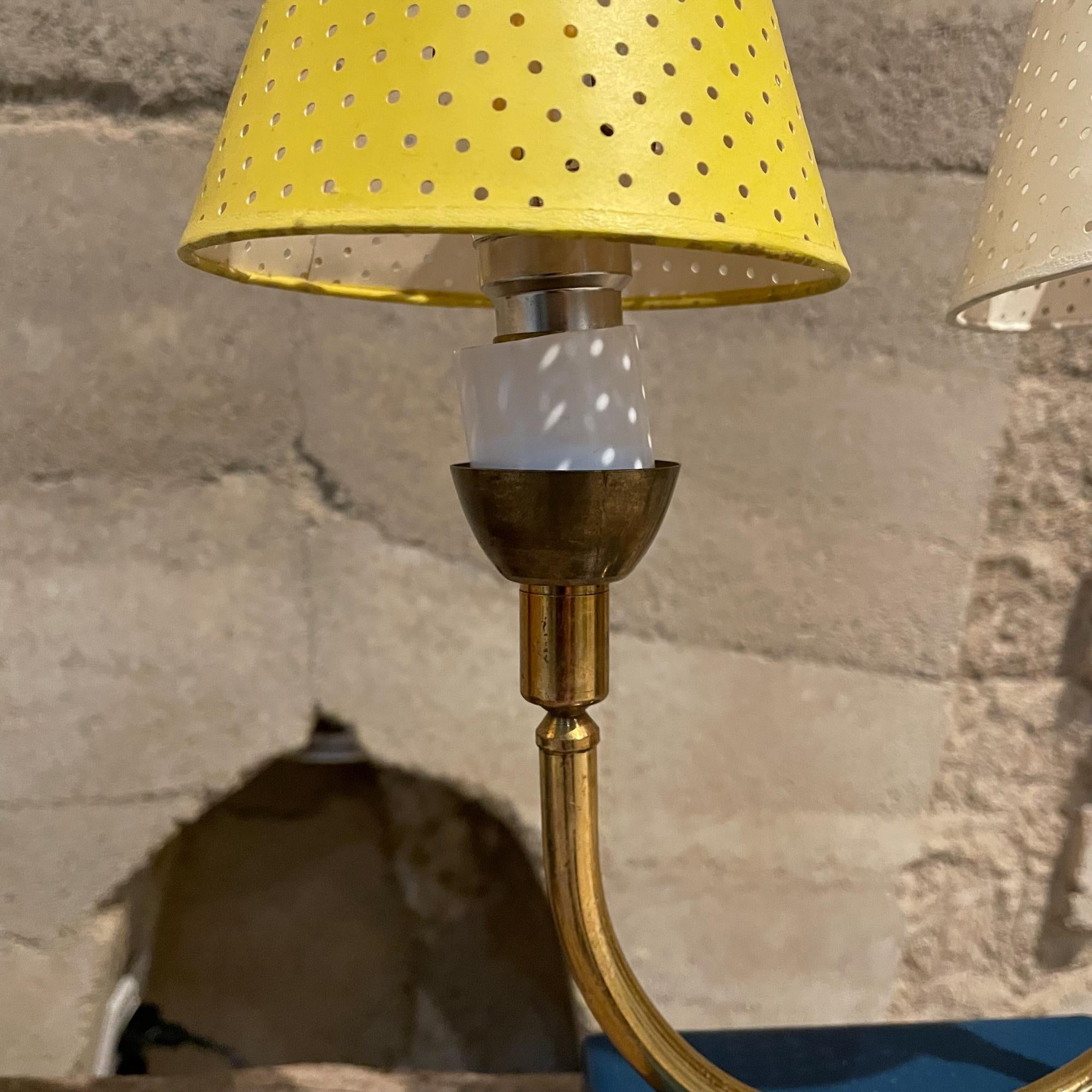 Dainty French pair of table lamps totally French! Vintage from France 1950s
Brass on blue painted metal wood base platform presentation -simply delightful pair of lamps.
Two lights each lamp -comes with perforated paper shades in white and yellow