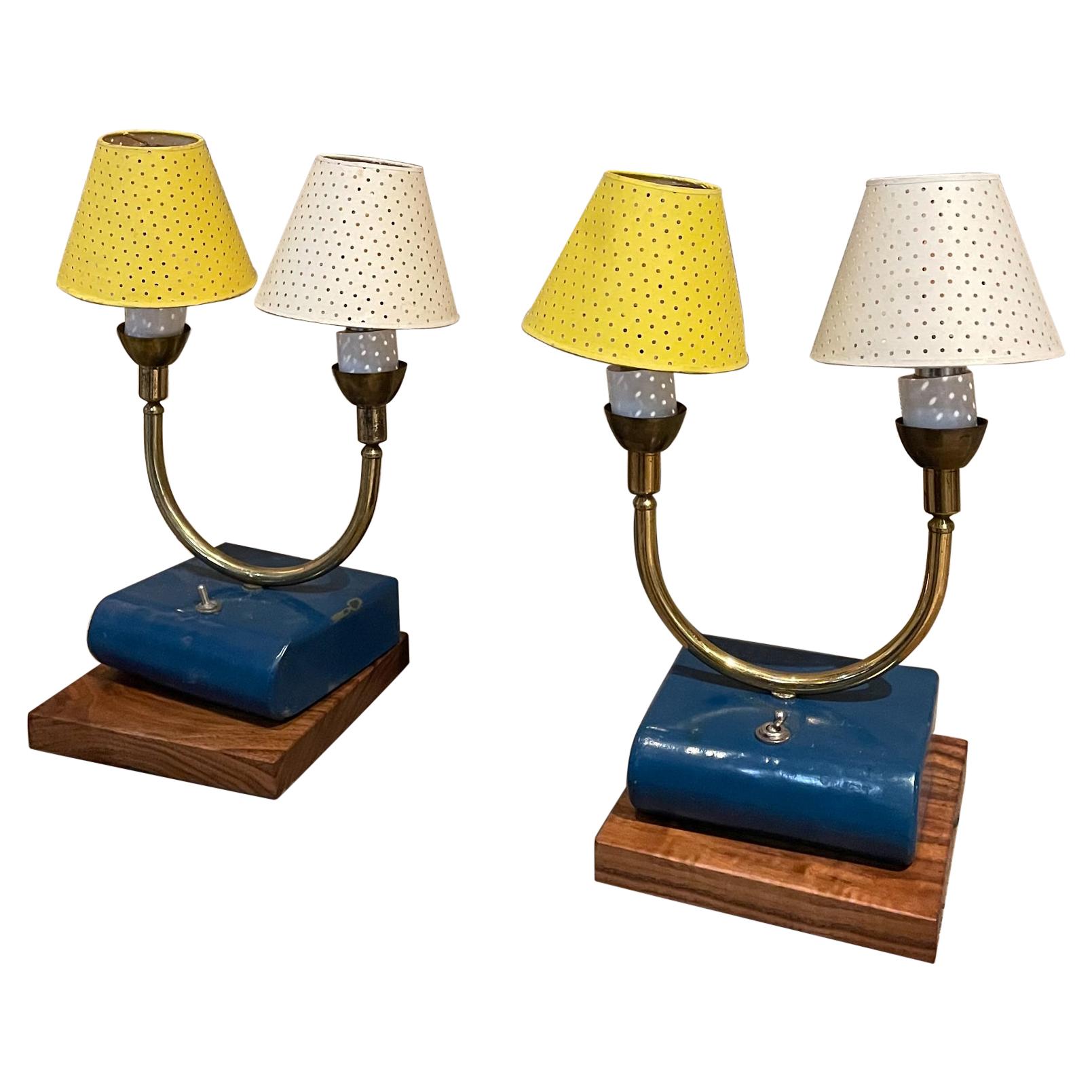 AMBIANIC presents
Dainty French table lamps Vintage France 1950s
Brass on blue painted metal wood base 
Two lights each lamp -comes with perforated paper shades in white and yellow 
attributed style Pierre Guariche 
No label 
12.75 H x 6.25 D x 6 W