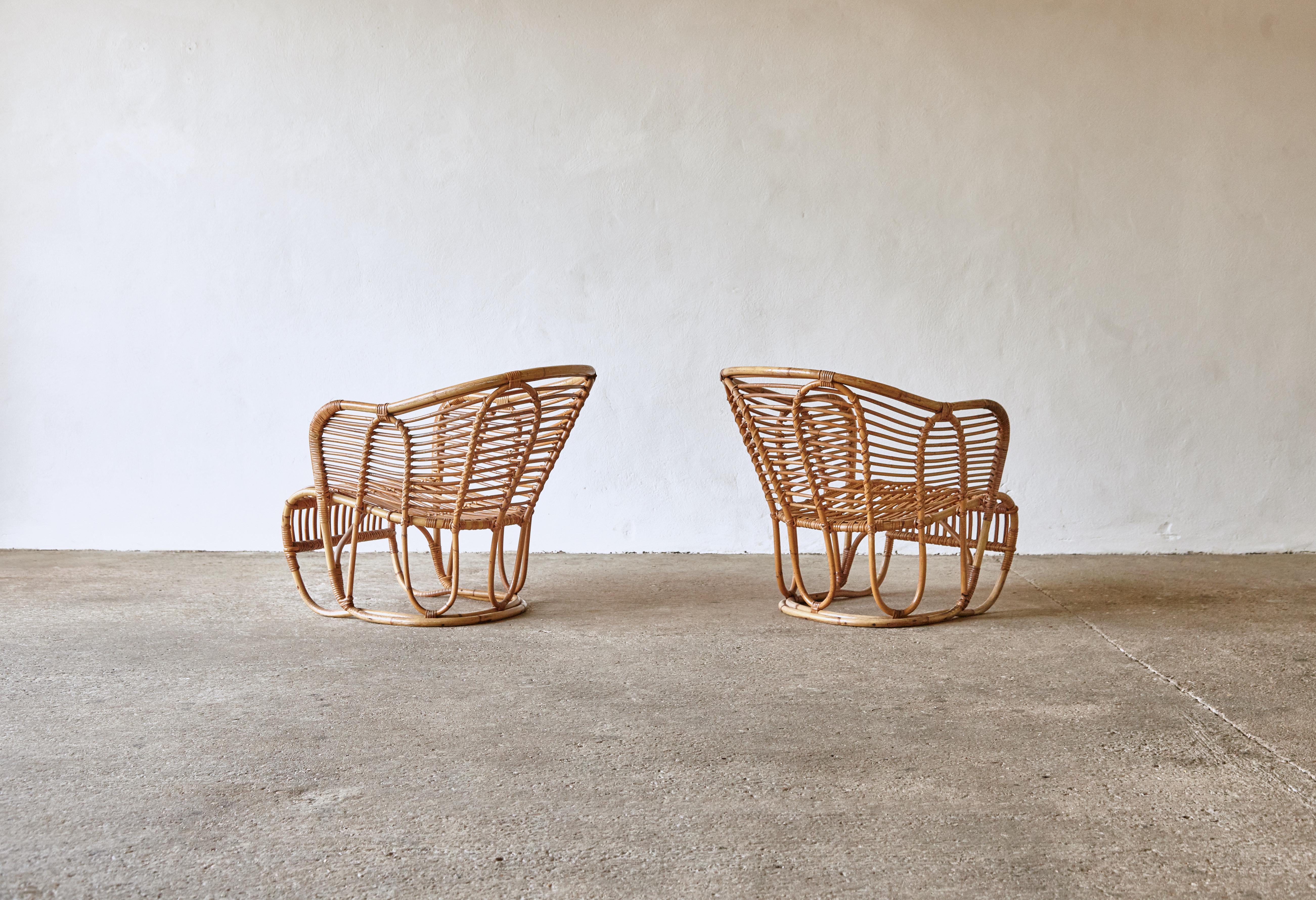Pair of graceful Tove & Edvard Kindt-Larsen Model 3446 bamboo and rattan chairs, produced by Robert Wengler, Copenhagen, Denmark, 1940s. Designed by Kindt-Larsen for the Danish Pavilion at the New York Expo of 1939. Good original condition with some