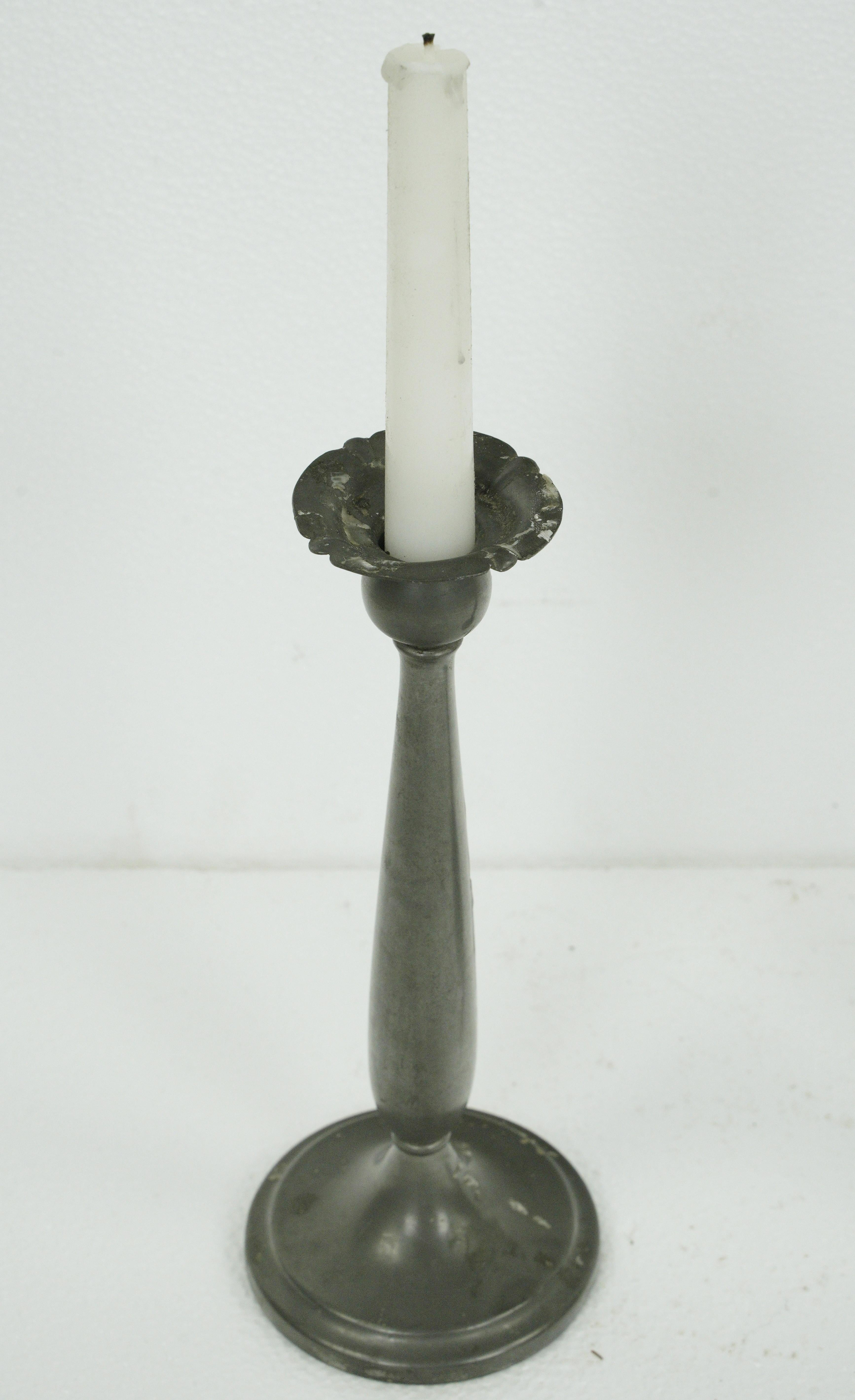 Slender pewter candle holders. Good condition with appropriate wear from age. Priced as a pair. Please note, this item is located in our Scranton, PA location.