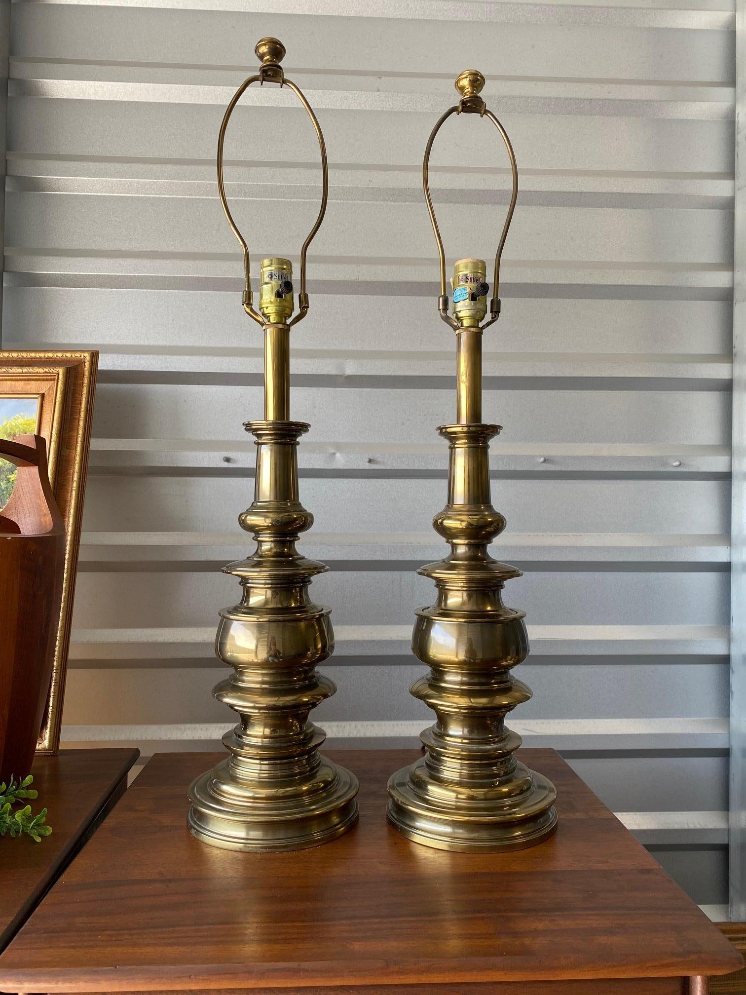 This is a beautiful pair of brass lamps by Stiffel. Such a gorgeous design. Spots of tarnish from age, but appropriate wear. Perfect table lamps to compliment any living space in your home.