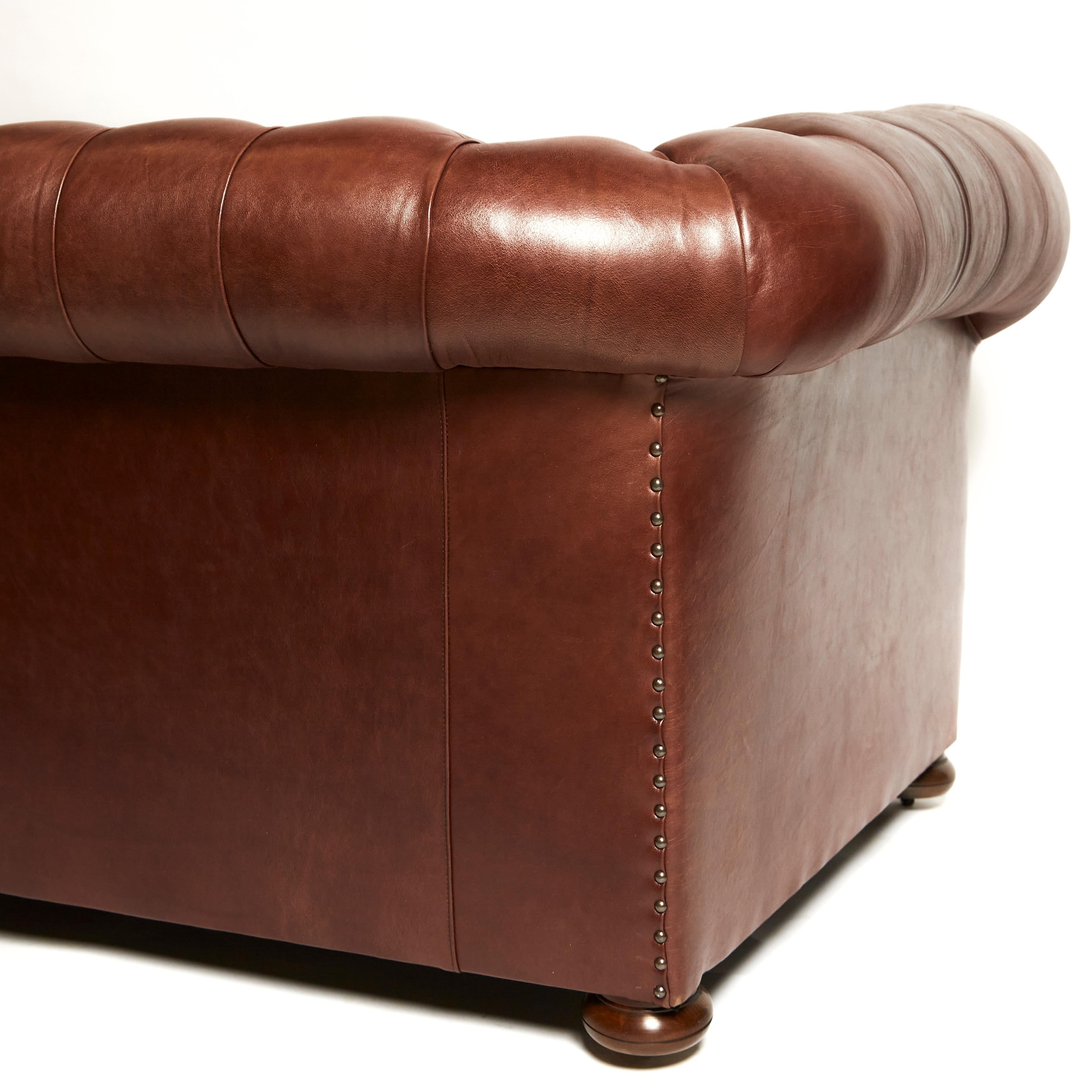 British Pair of Traditionally Designed Large Chesterfield Leather Sofas