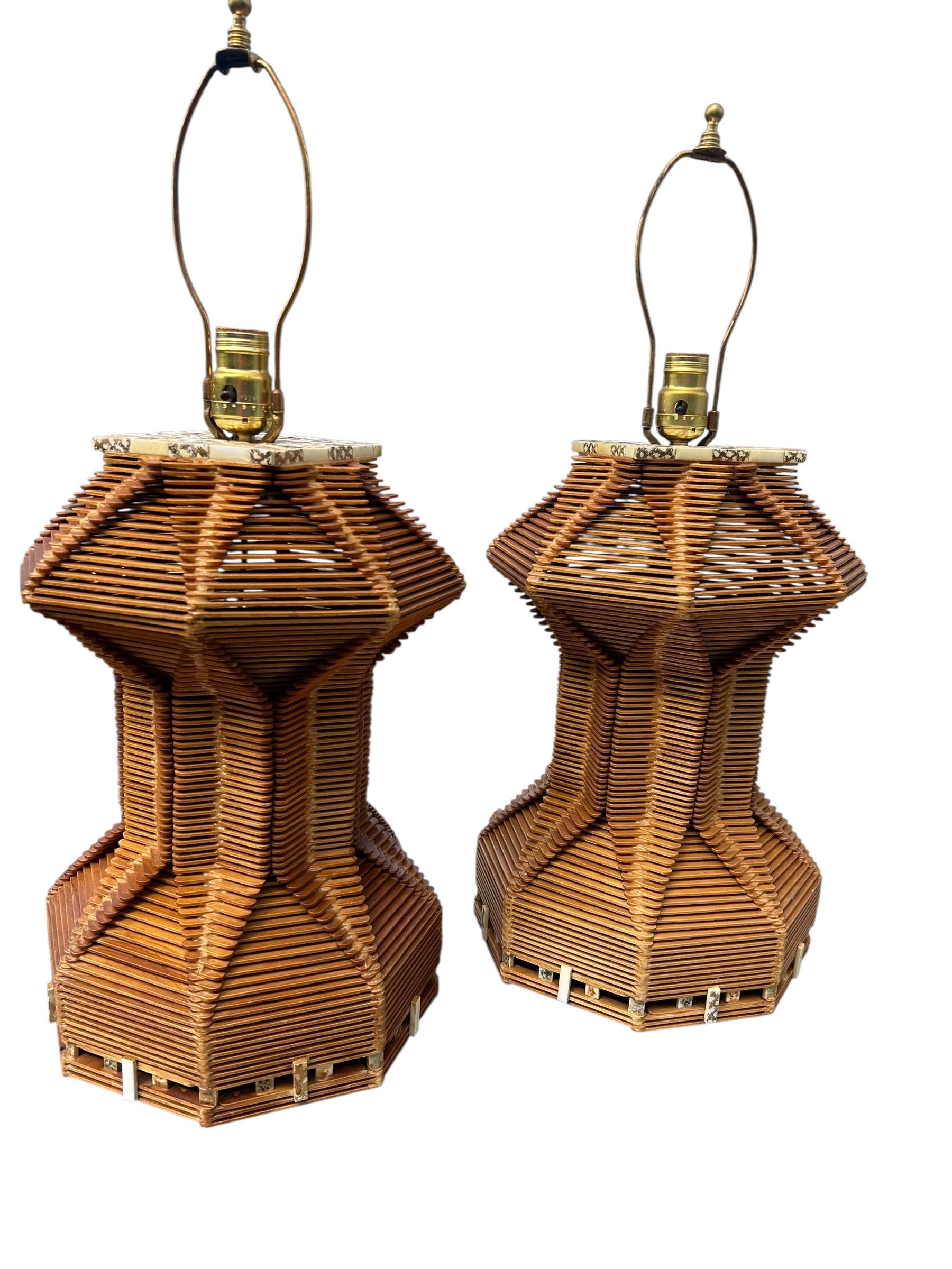 Fantastic Pair of Tramp Art Popsicle Stick Lamps. Geometric design constructed from popsicle sticks that have been assembled and glued together to form the geometric structure, the lamps are then coated in shellac. Lamps are accented with mid