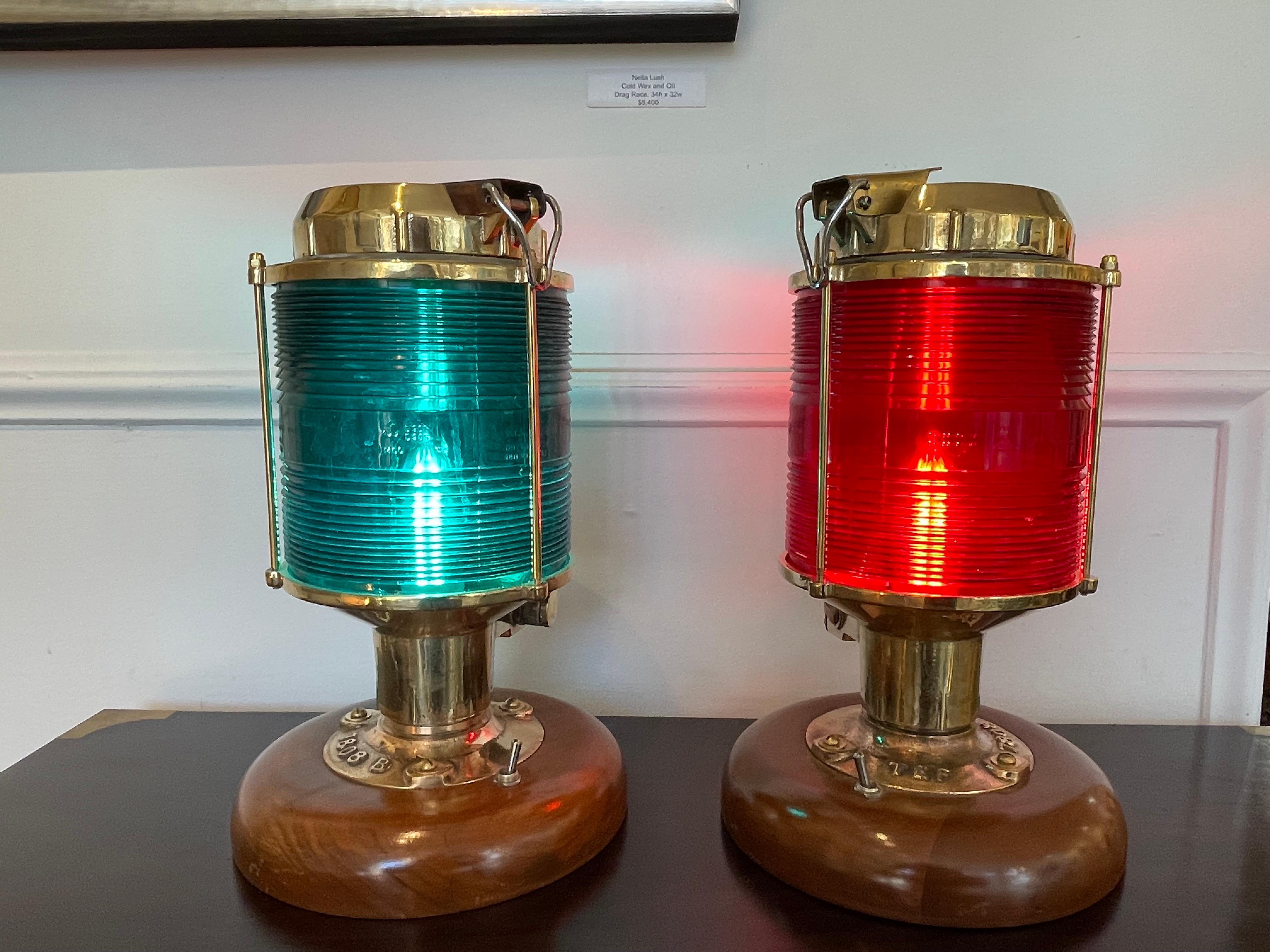 Pair of solid brass port and starboard navigational ship's post lights with the expected red and green Fresnel glass lens. Maker is Tranberg, Circa 1980's. Norwegian. Originally European wiring, these have been rewired for American use and the