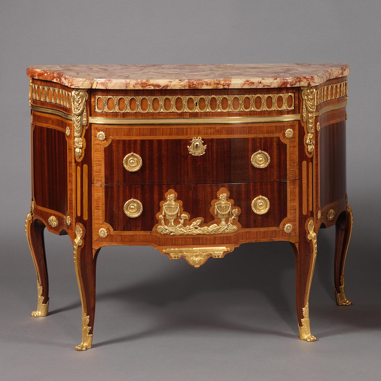 A Fine Pair of Transitional Style Gilt-Bronze Mounted Parquetry Commodes, by Paul Sormani, After the Model by Charles Topino.

Stamped beneath the marble top to one commode ‘SORMANI’ also stamped on the lockplate ‘P. SORMANI , PARIS., 10 RUE