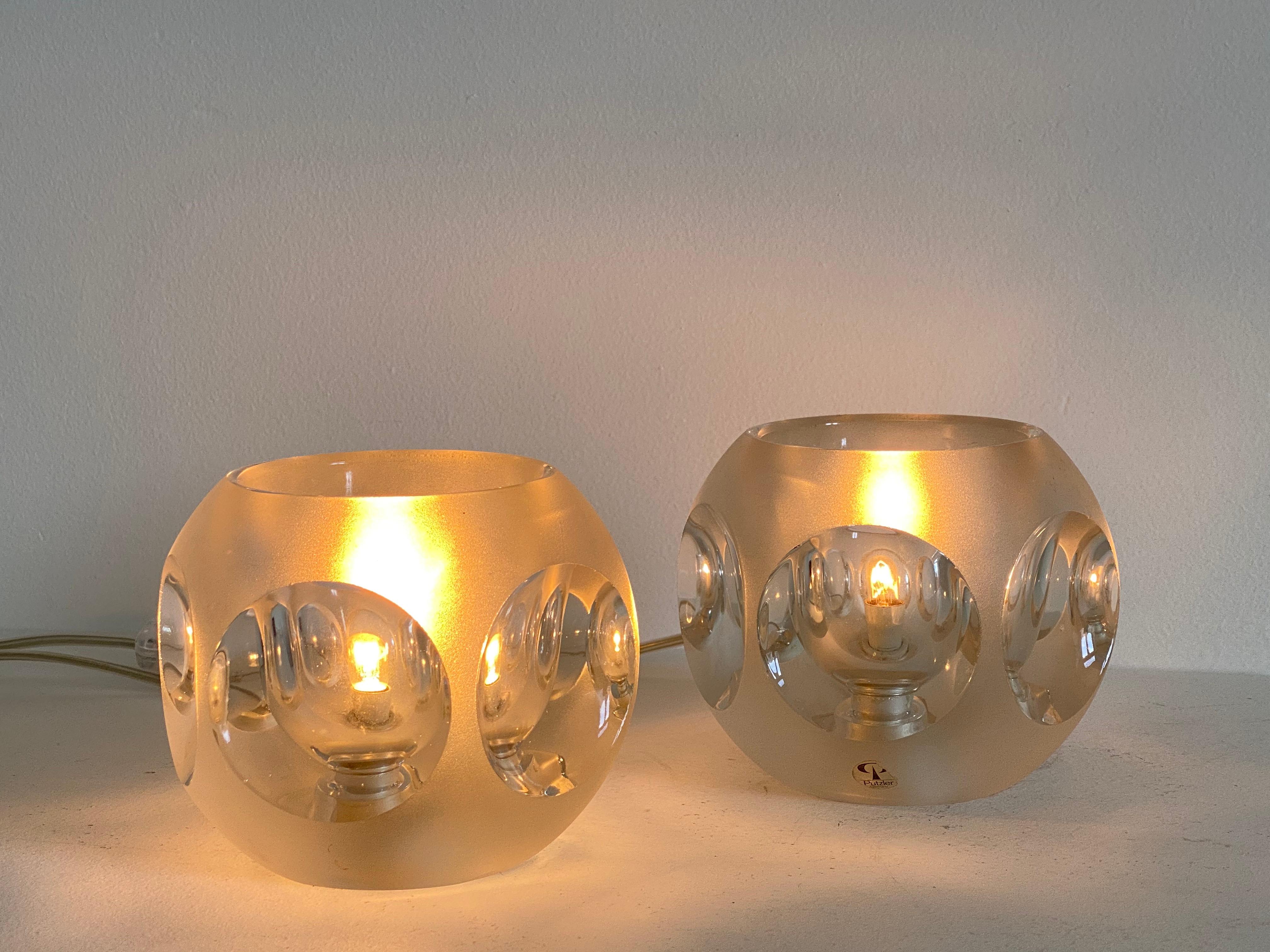 Set of 2 transparant ice glass cube table lamps by Peill & Puzzler, 1970
fully functional,
marked with original brand label.