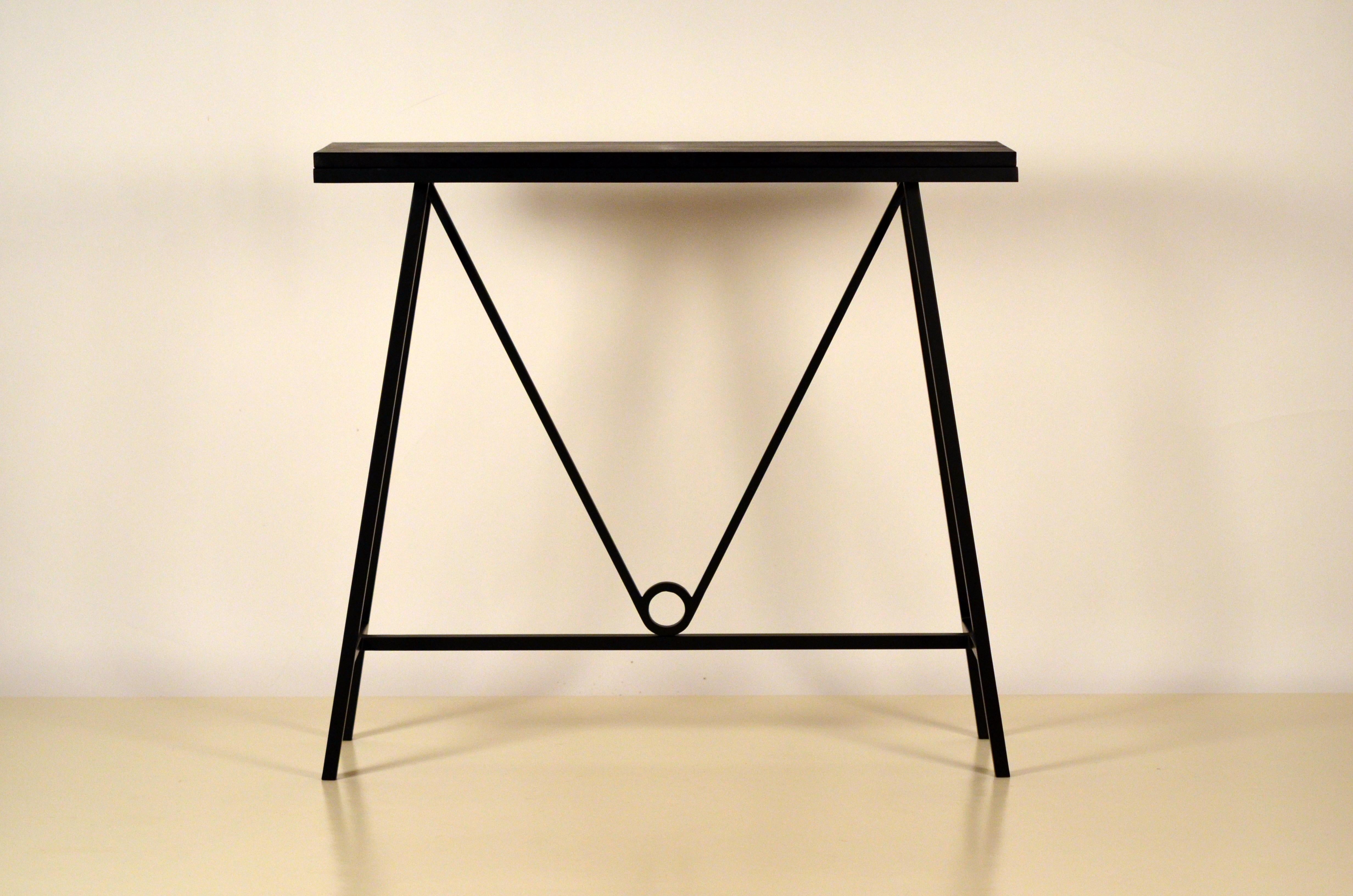 Pair of 'Trapèze' blackened steel and goatskin consoles by Design Frères.