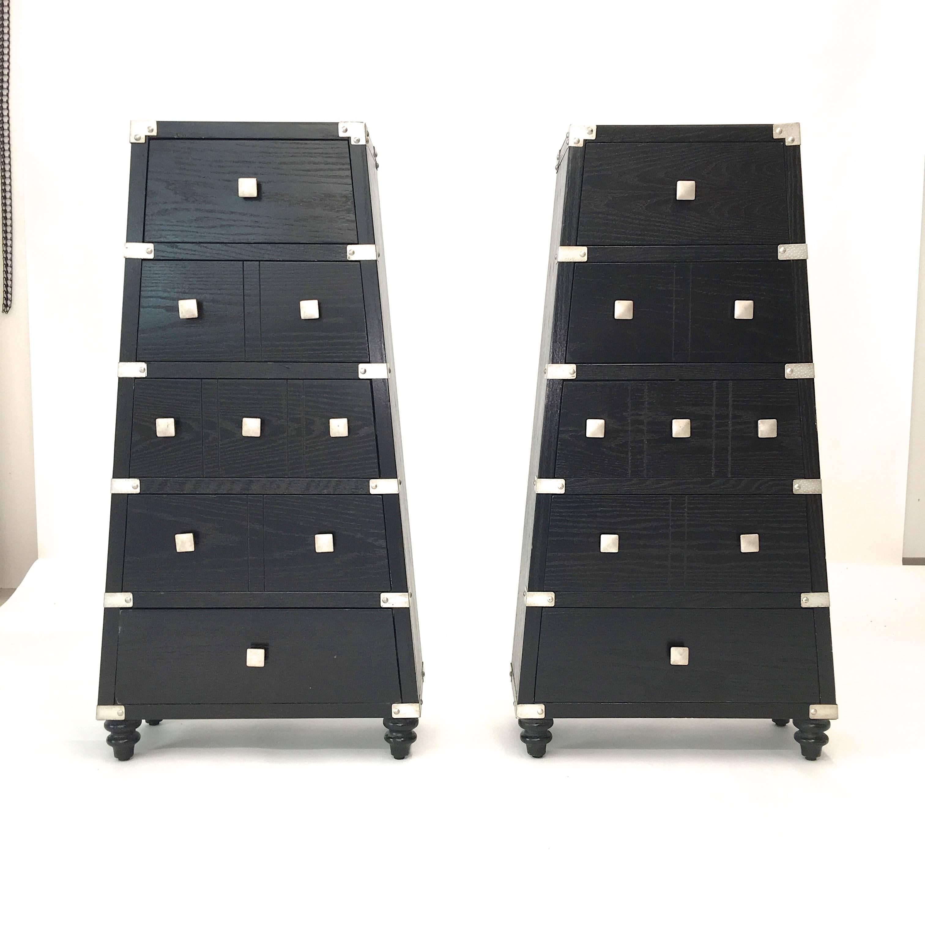 Pair of stylish pyramid form chest of drawers made of ebonized oak and embellished with hammered silver metal accents. 

Sold as a pair.