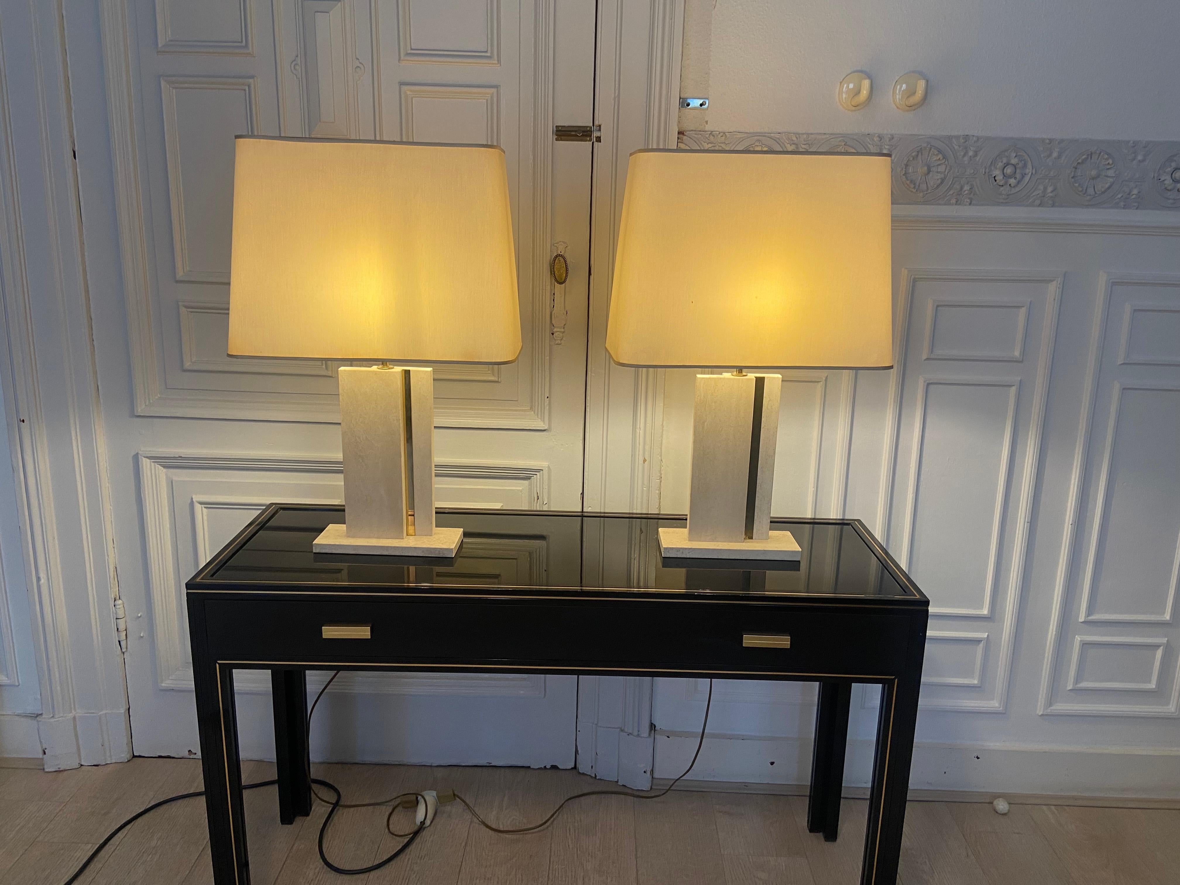 
Pair of travertine and brass lamps