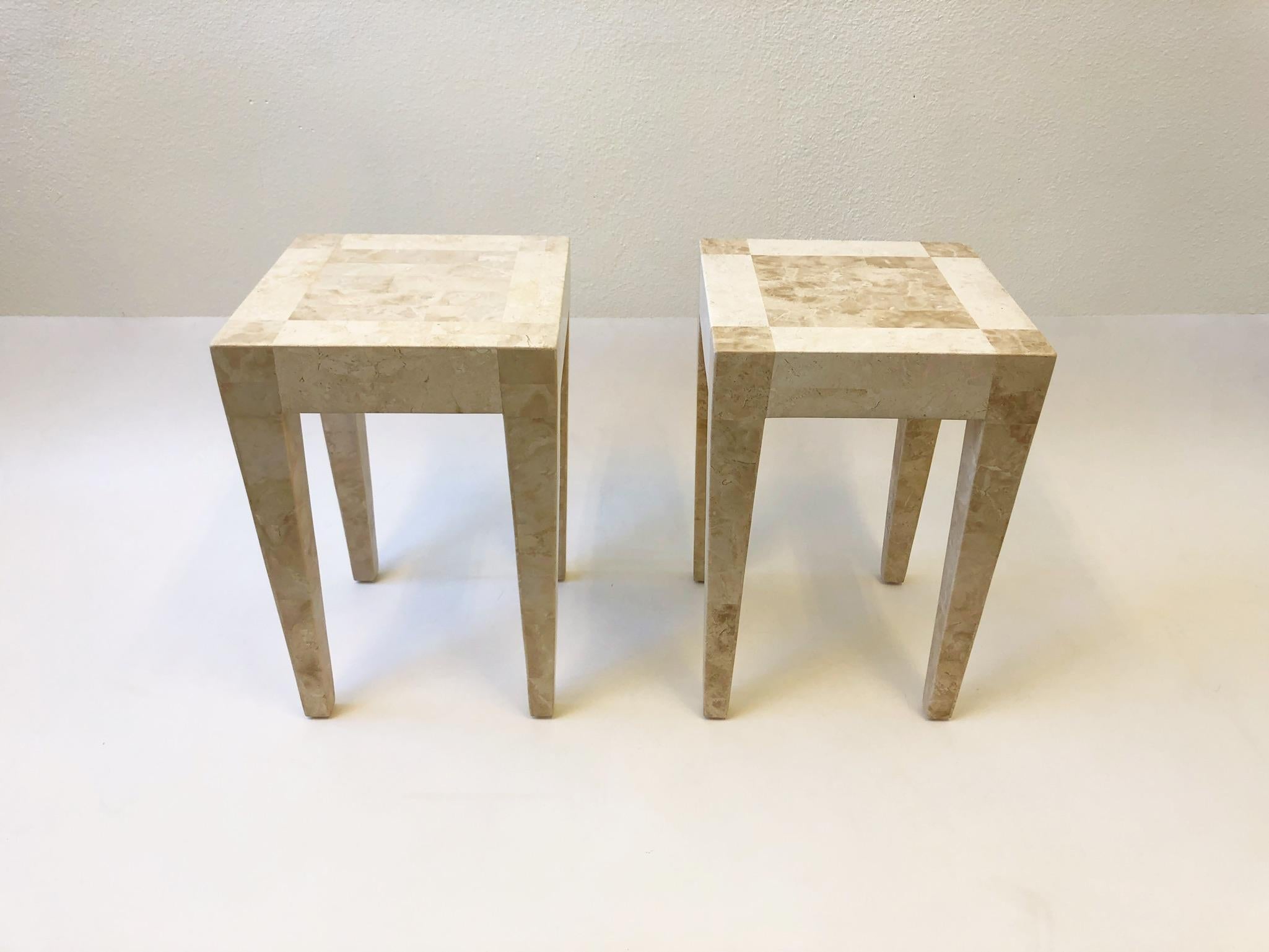A beautiful pair of travertine and marble side tables, design by Maitland Smith in the 1980s. One table is darker then the other. The table are constructed of wood with a travertine and marble veneer.
Dimensions: 14” wide 14” deep 21.25” high.