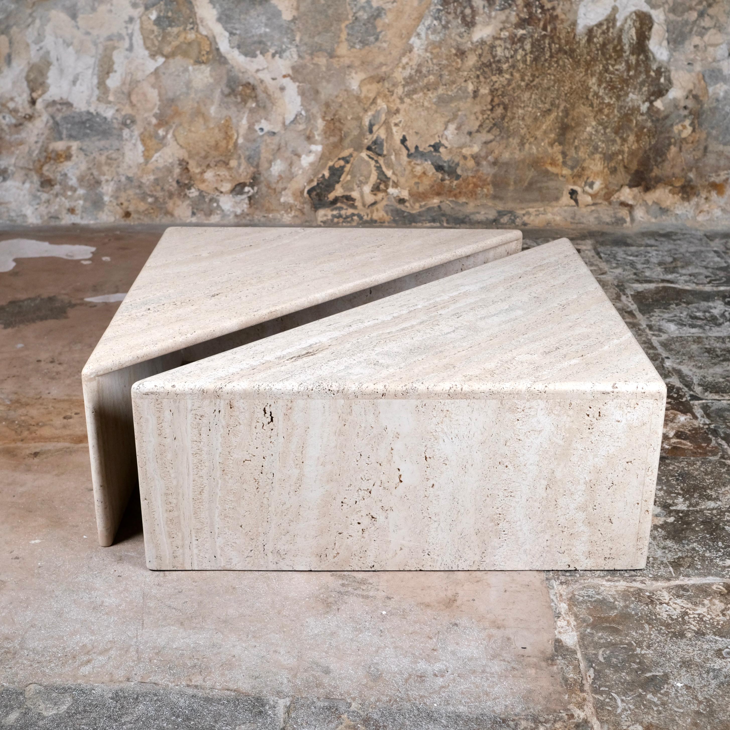 Pair of travertine coffee tables by Ligne Roset, made in France in the 1970s.
Two perfect angles that can be arrange as you like to never get bored.
Very good condition, traces of time and a light restoration at one corner angle (see