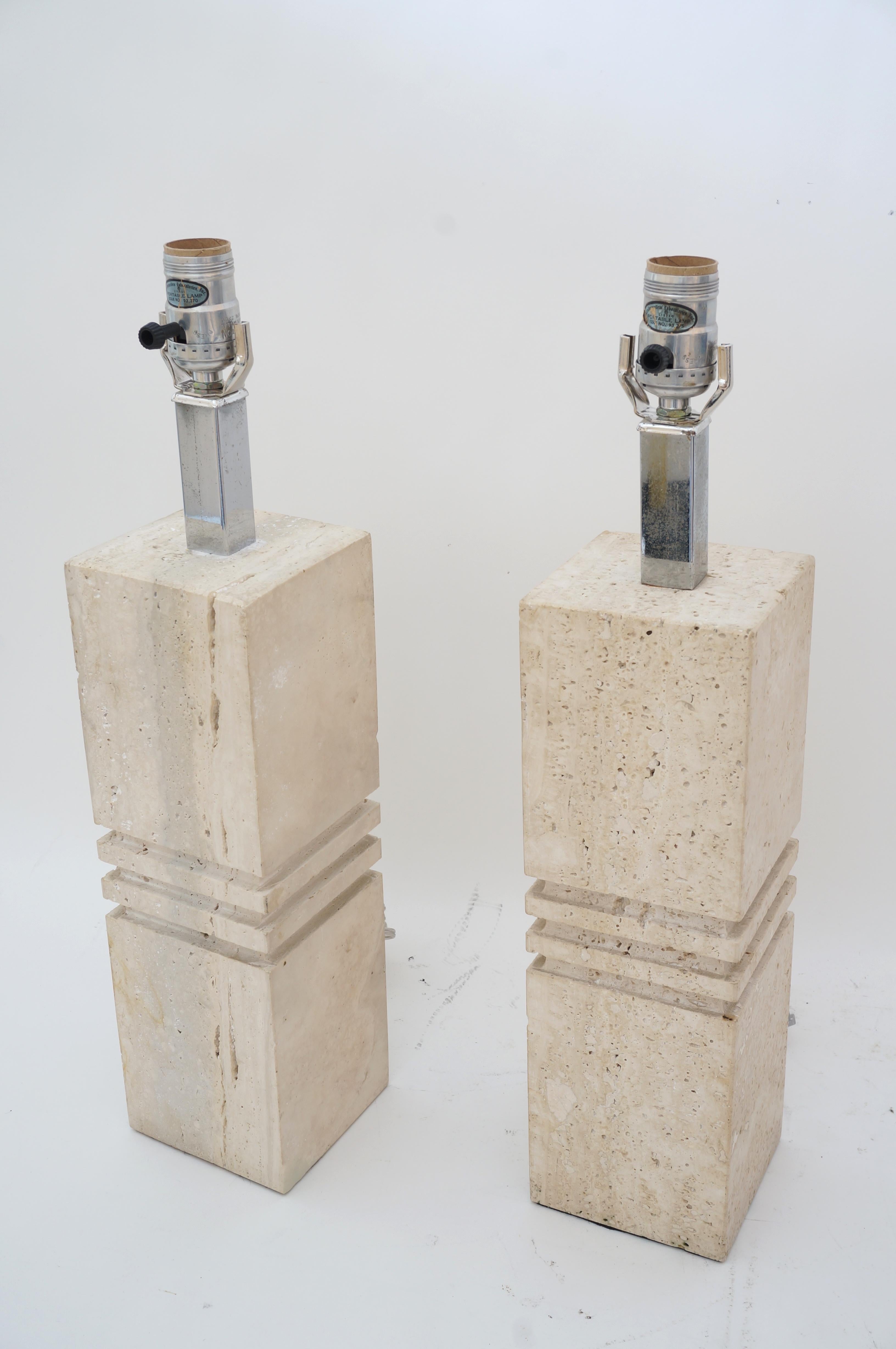 This stylish pair of Italian travertine table lamps we're designed by Reggiani for Raymor Lighting in the 1970s. 

Note: These lamps have been professionally rewired and the paper insulatiors replaced.

Note: We also have a single lamp available
