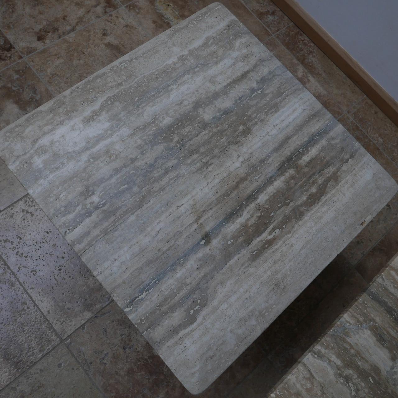 A pair of travertine or veined marble side tables. 

Good quality, simple elegant design.

Likely Italian, circa 1970s.

Can be used as coffee tables or side tables depending on the room size. 

Dimensions: 60 W x 60 D x 44.5 H in cm.
  