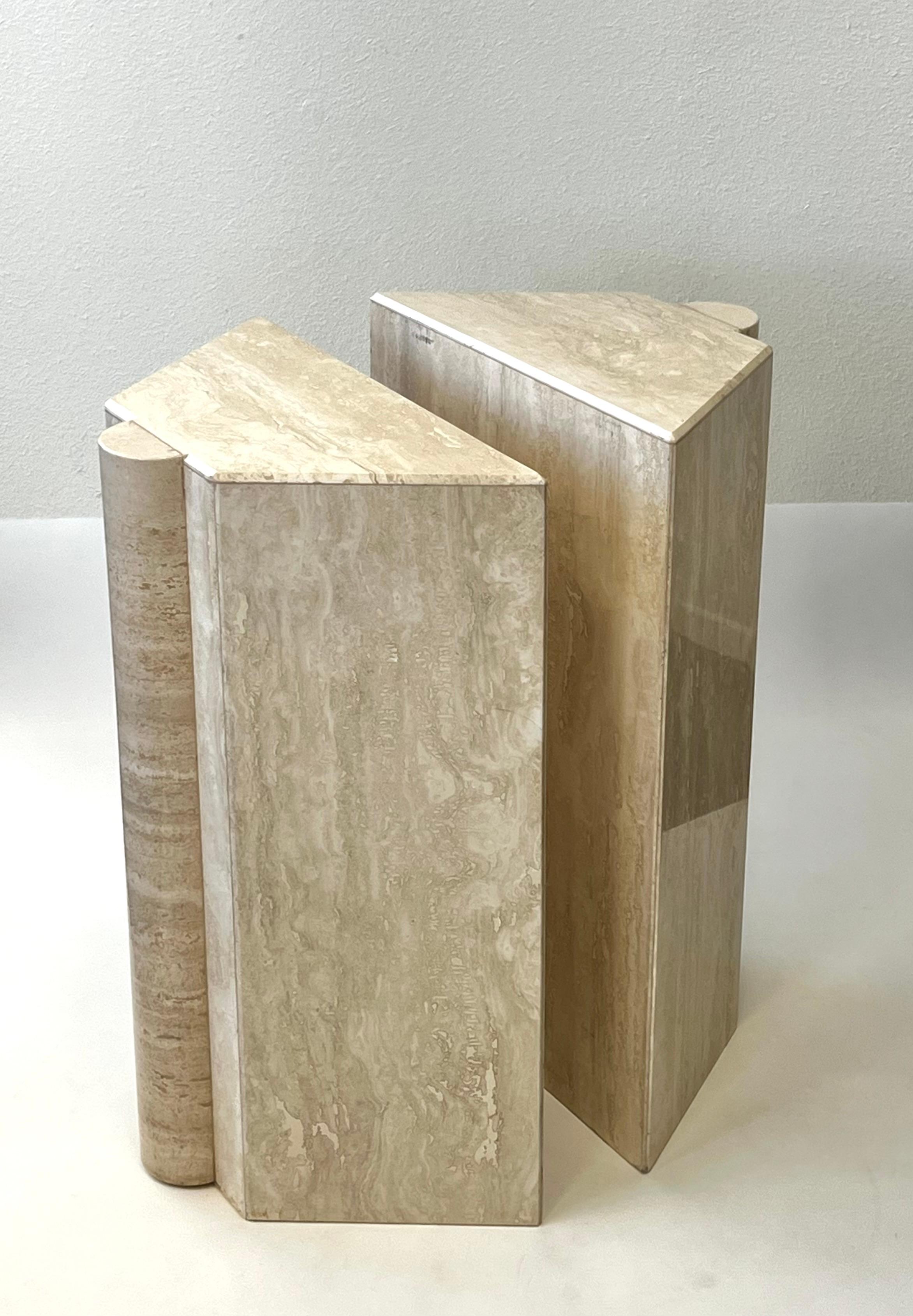 Cool 1980’s polish travertine Post-Modern dining table or Console pedestal bases. 
In beautiful vintage condition. 
They can be used with a round, rectangular glass top for a dining table or as a pedestal for a sculpture. 
Measurements of each: