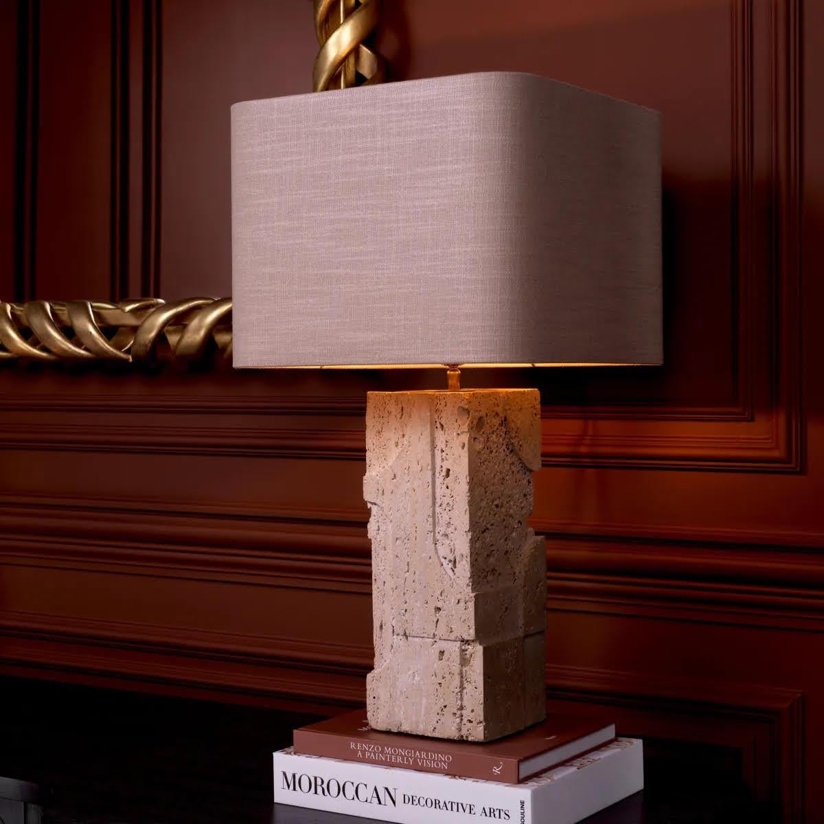 Pair of Travertine table lamps, the perfect addition to any luxurious interior.

This pair of table lamps is a true masterpiece that exudes timeless elegance and refinement. Handcrafted from travertine, each lamp is unique and features natural
