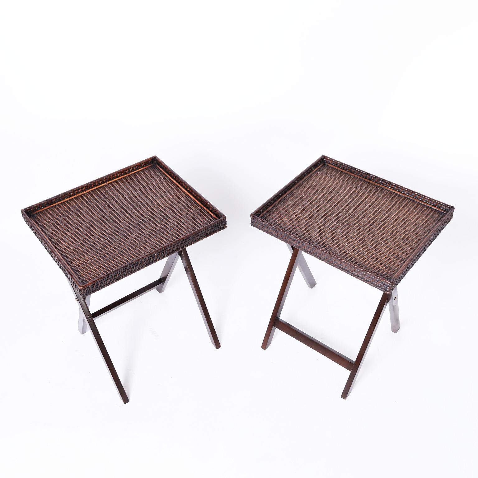 Vintage pair of folding tray or serving tables with woven rattan tops ambitiously crafted with galleries on folding X style bases.