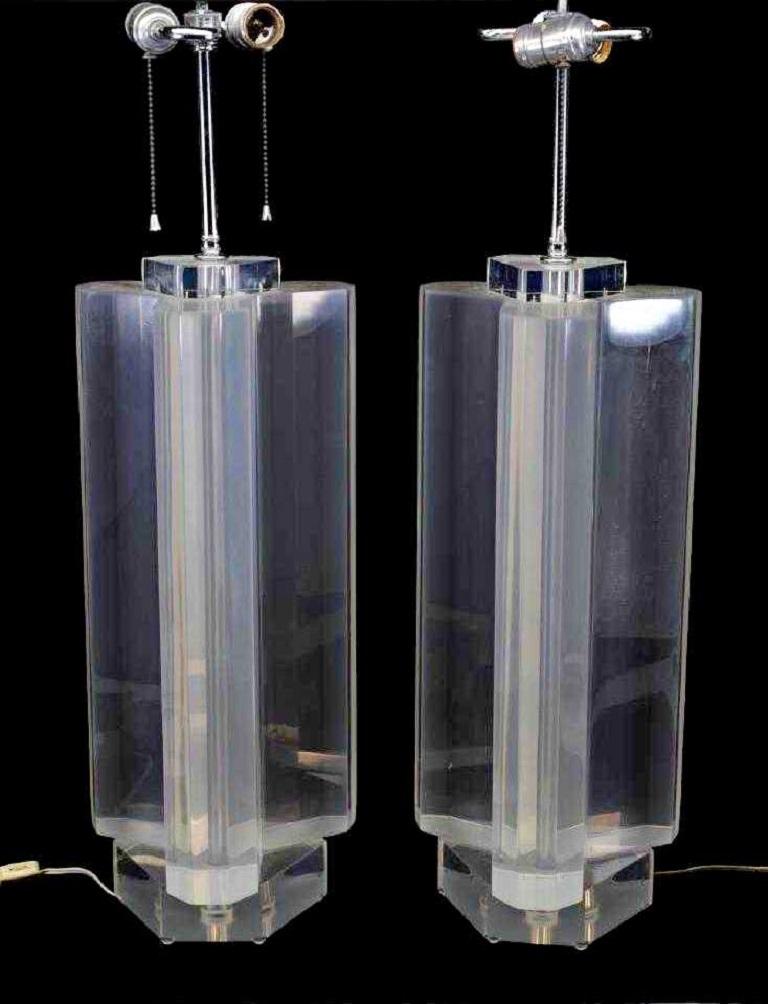 A magnificent pair of heavy Lucite table lamps by Les Prismatiques of New York. Ralph Gambaro, the company's founder, invented Prismacolour, an acrylic that came in shades of aqua, bronze, lavender, blue, pink, gray, and green. He also worked with