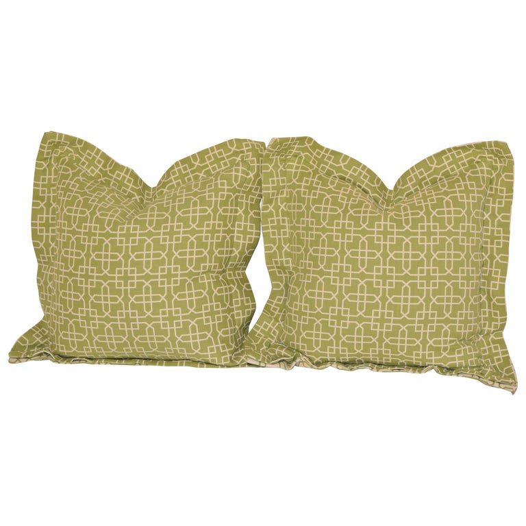 Handmade pillows in a trellis pattern with butterfly flanges surrounding the pillows. The front side is green with white trellis and the reverse is on the back, or vice-versa. These pillows are hand sewn and the materials are made in the USA.