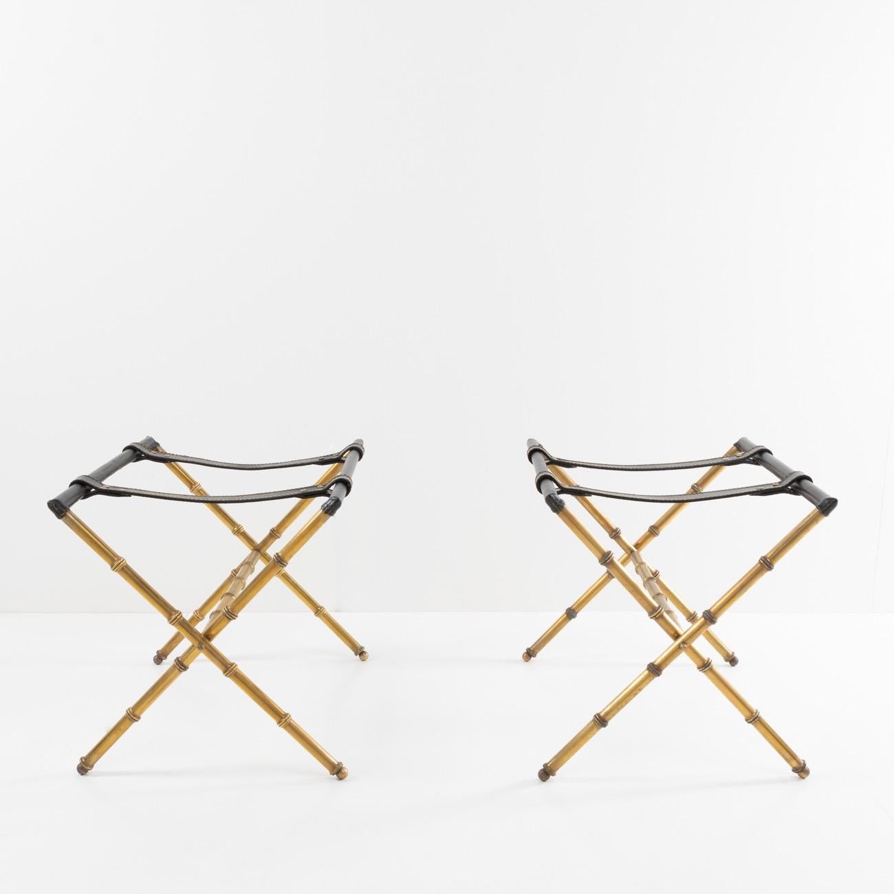 Originally designed by Jacques Adnet to accommodate one or more suitcases, these trestles can also be used as a support for a tray or arranged in pairs as coffee table legs. 
They are entirely made of solid copper, (Jacques Adnet and the Compagnie