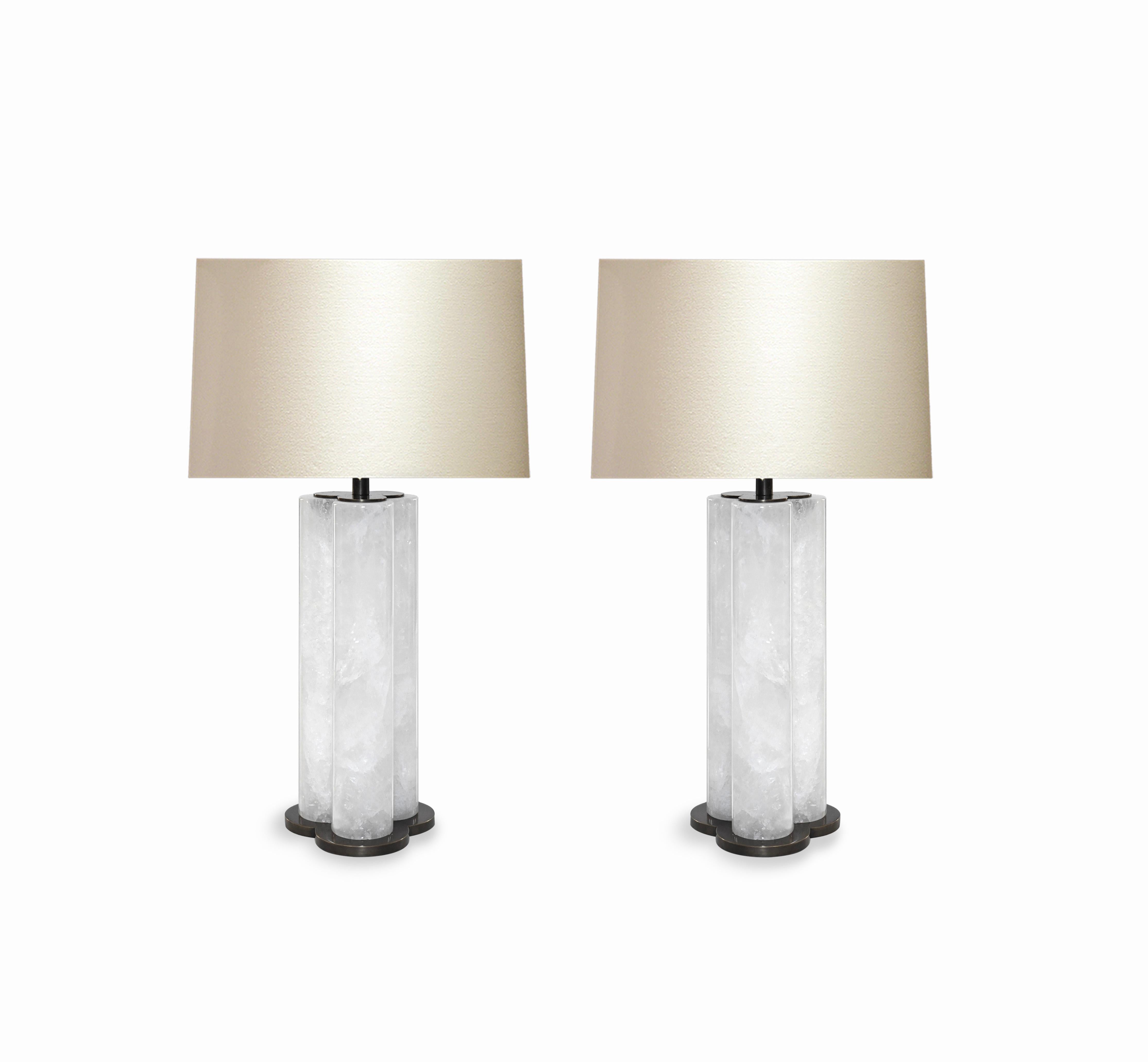 Pair of tri-column rock crystal quartz lamps with antique brass bases, created by Phoenix gallery, NYC.
To the top of the rock crystal: 11.75