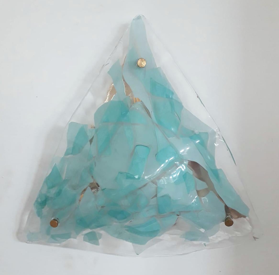 Vintage Italian wall lights or flush mounts with blue and clear triangular Murano glass diffusers mounted on brass frames / Made in Italy by La Murrina, circa 1970s.
Original mark on glass
Measures: height 16.5 inches, width 17.5 inches, depth 4.5