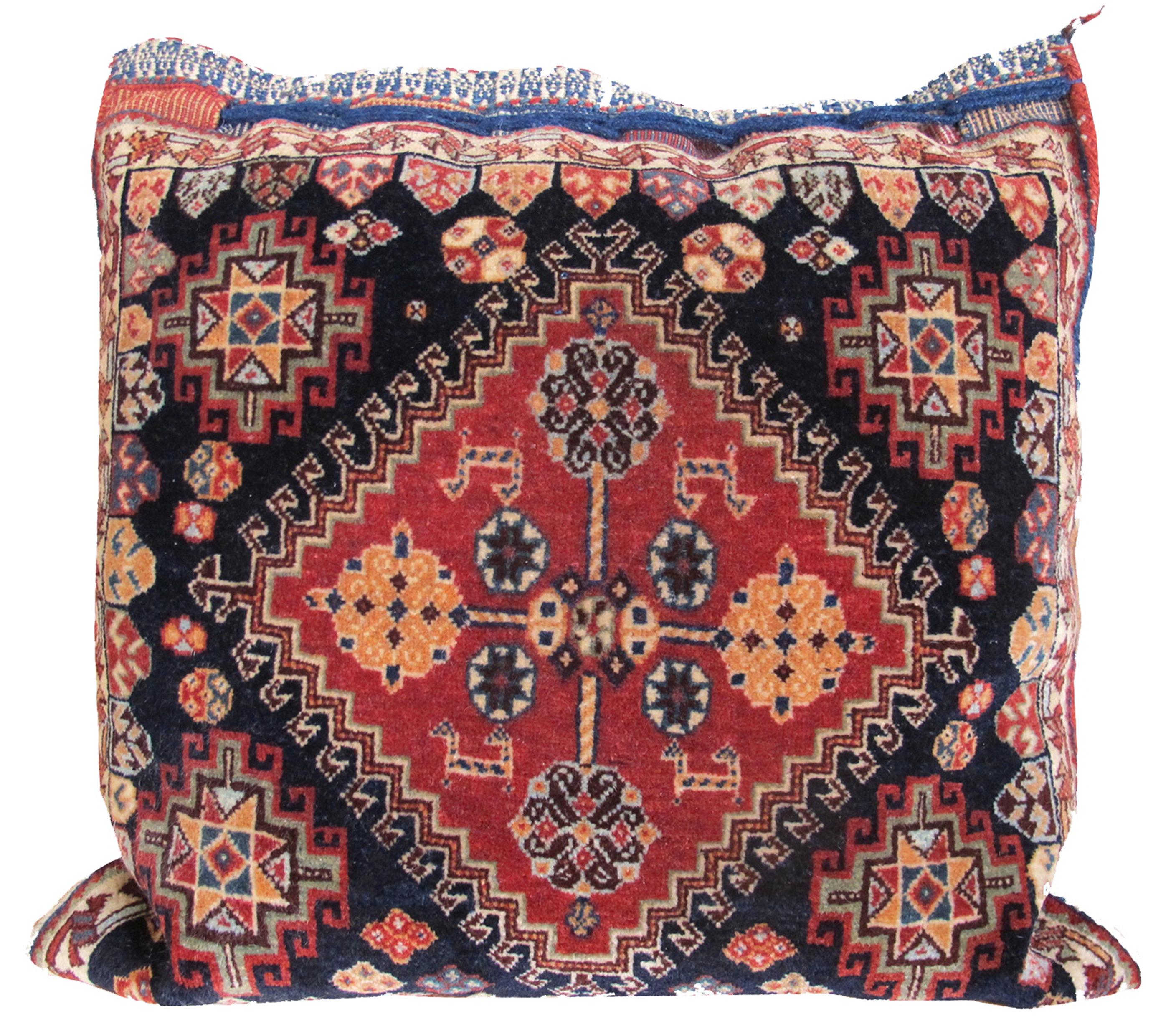 Pair of Southwest Persian Tribal Qashqai Bag Fragment Pillows with Striped Kilim Backs, c. 1900

Saddle bags have had an often difficult existence, transitioning from specific utilitarian objects in the Near East and Central Asia, where they were