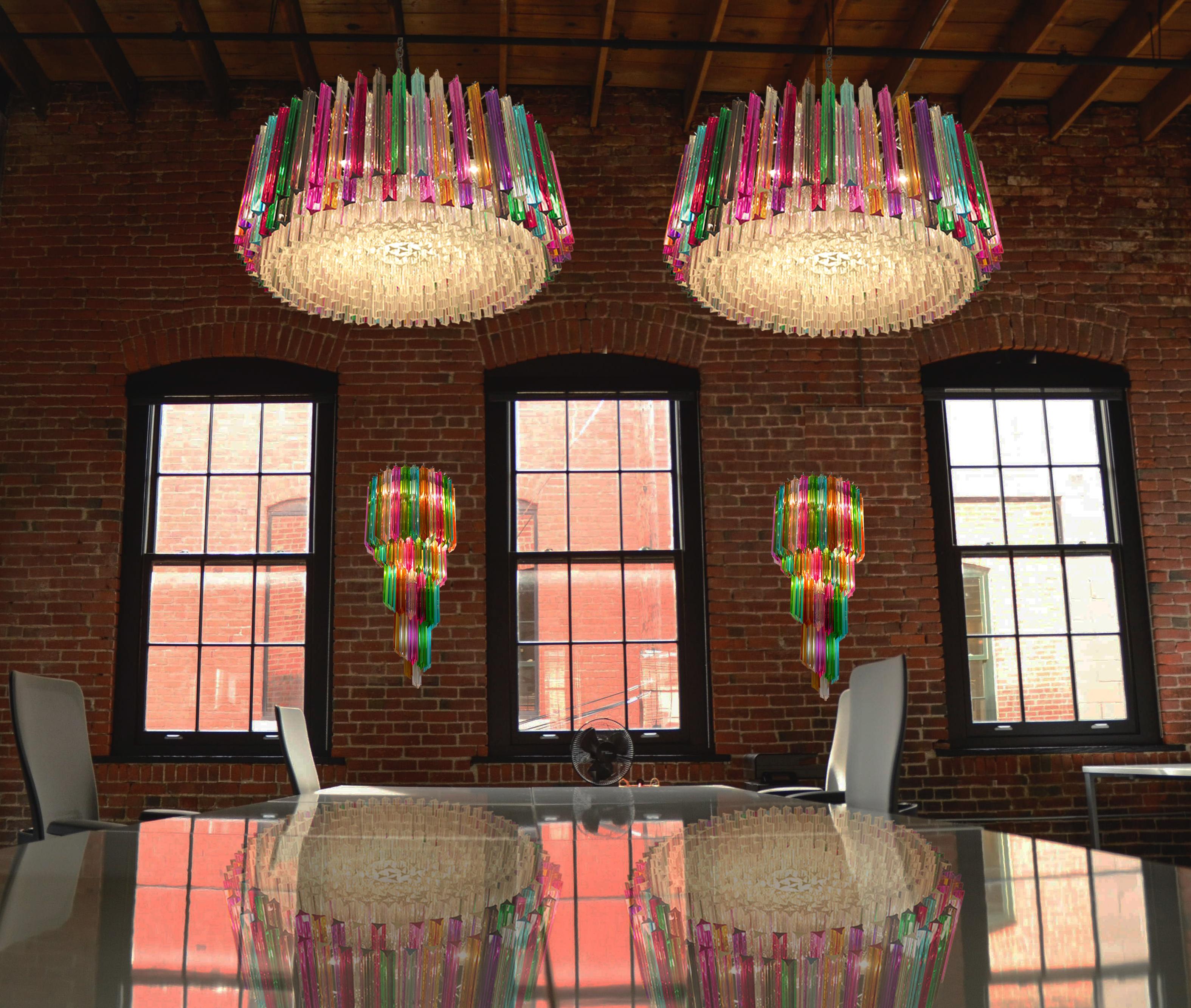 Pair of large and spectacular triedri Murano glass chandeliers - 391 prims multi-color
A magnificent Murano glass chandelier, 391 triedri (120 triedri multicolored + 271 triedri trasparent) on crome frame. This large midcentury Italian chandelier is