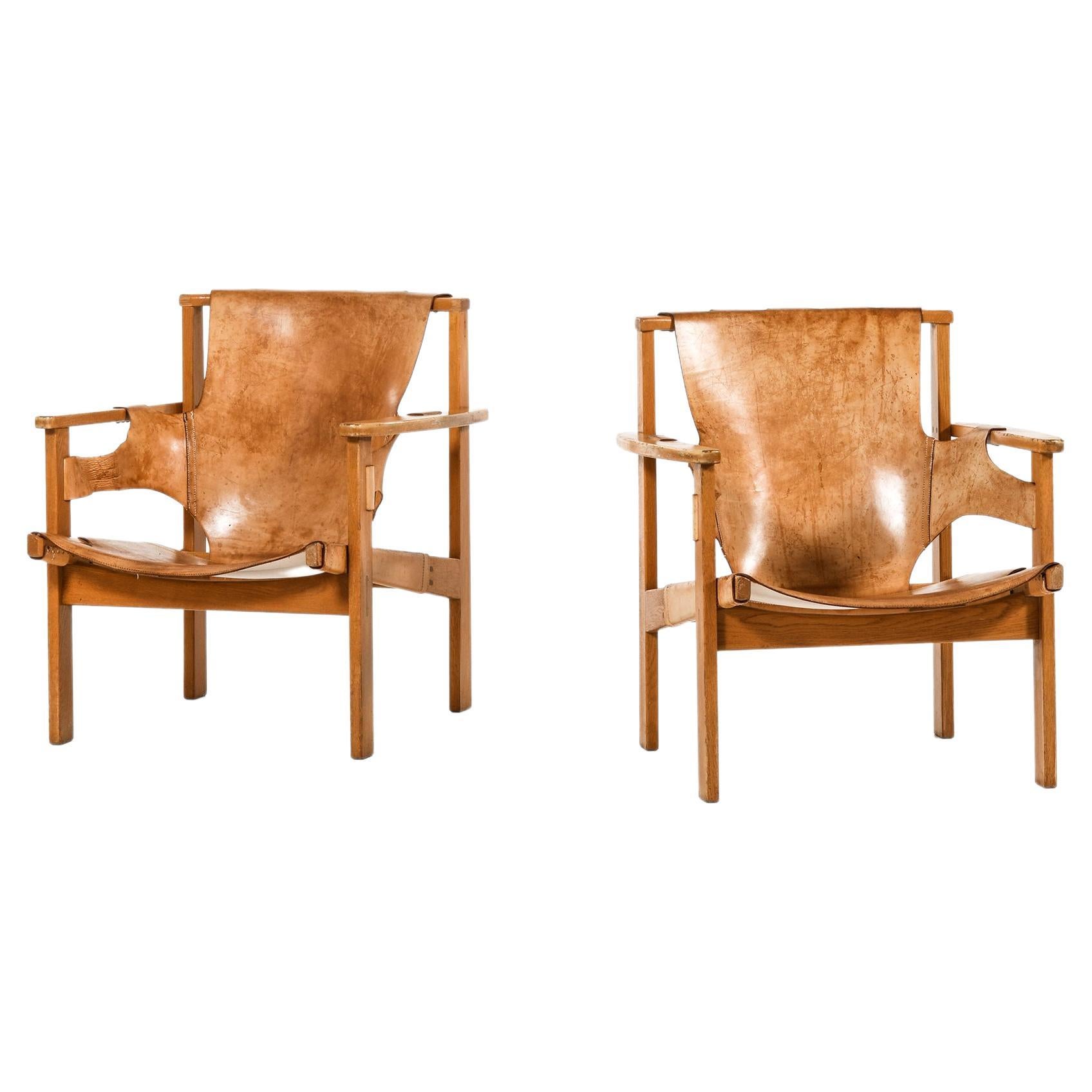 Pair of Trienna Easy Chairs in Oak & Original Leather by Carl-Axel Acking, 1957 For Sale
