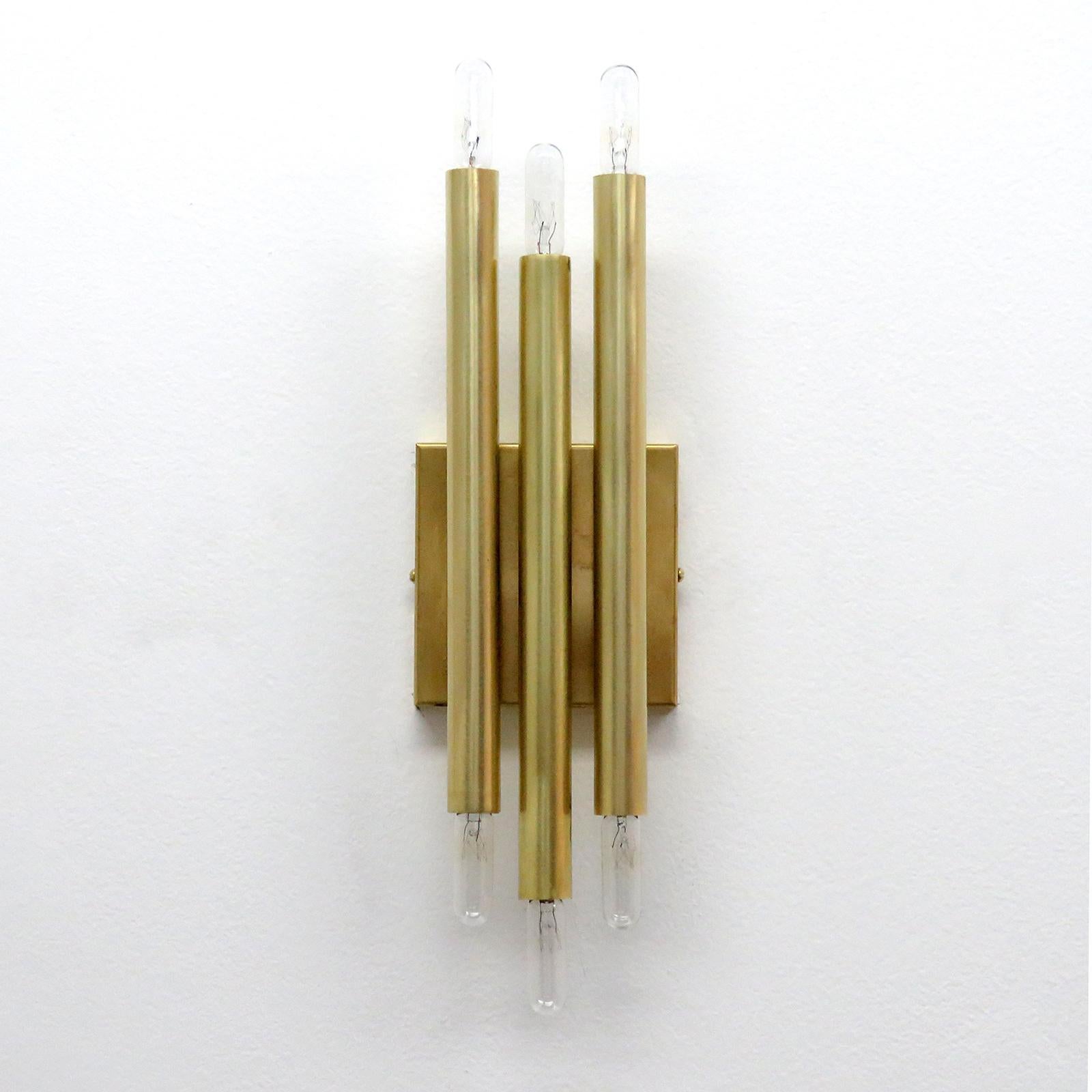 Great pair of raw brass geometric wall lights by Gallery L7, manufactured and hand finished in Los Angeles, with three brass double candles that can be mounted vertically or horizontally. Six E12 candelabra sockets per fixture, max. wattage 40w each