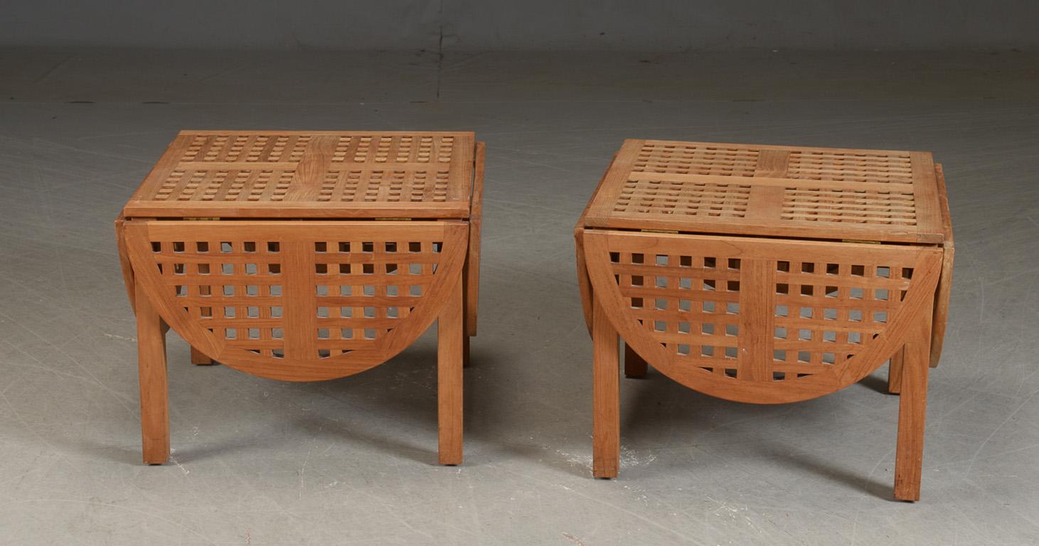 Pair of Danish Modern trip trap tables, in teak made for the Admiral Hotel, Copenhagen, with four flaps opening out into a clover form, or with two flaps up an ovoid form. 24.5x 24.5.'' Four flaps of 12''. Excellent as coffee table or side tables.