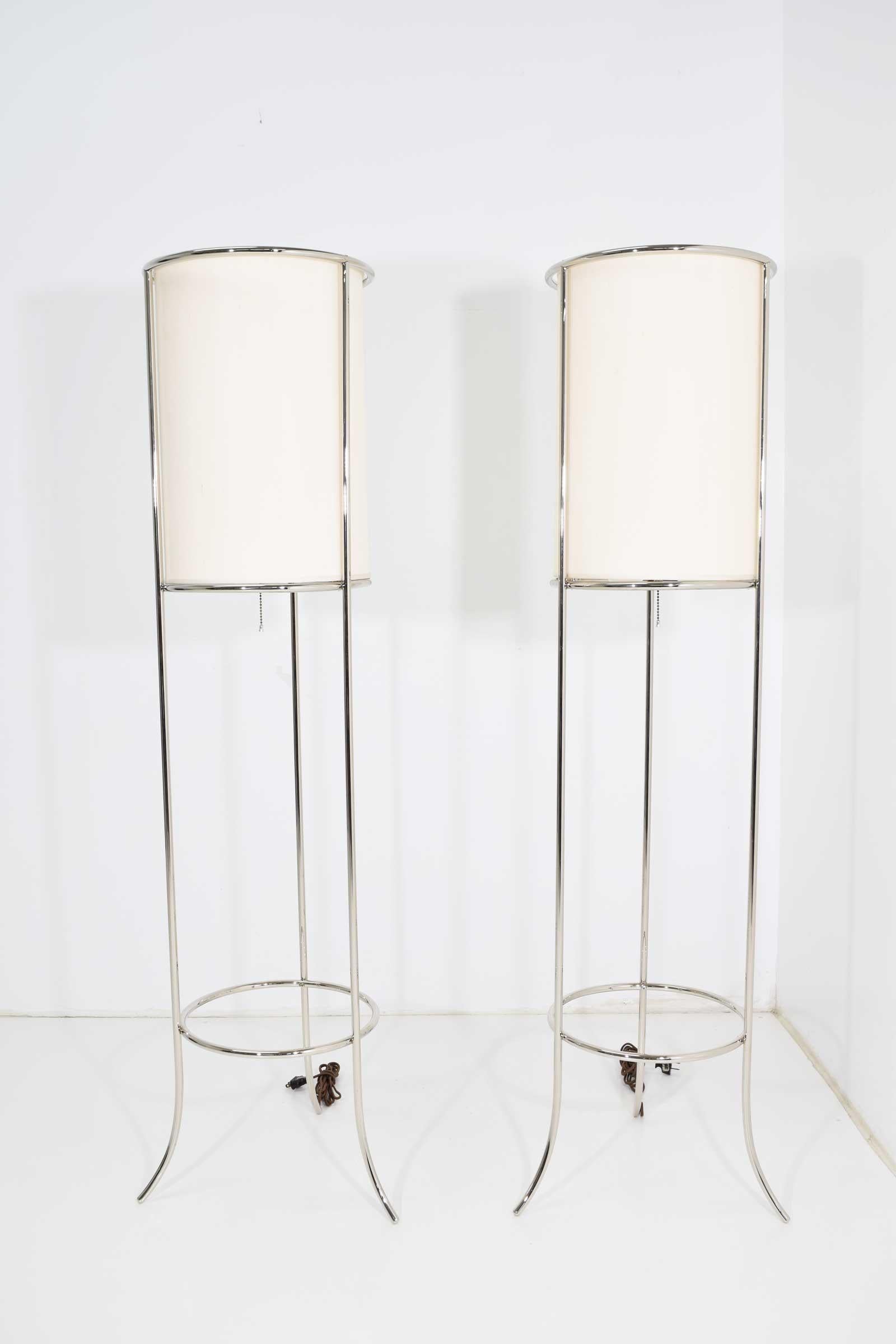 Nickel frame floor lamps with silk shade, fabric cord, two lights per lamp. Newly rewired.