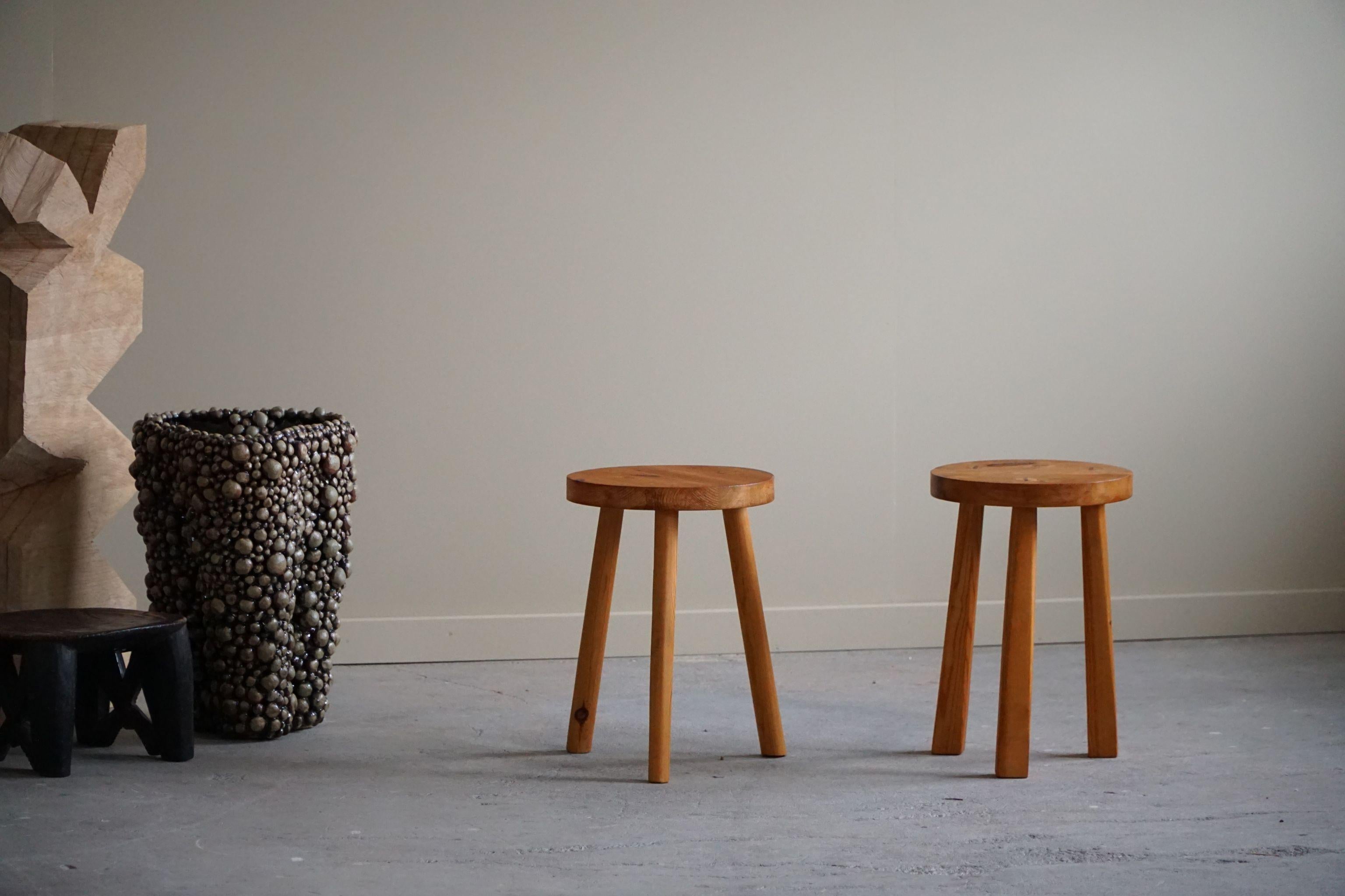 A pair of really decorative stools in solid pine. Made by a Swedish cabinetmaker in 1960s. They can easily be used as bedside tables or a decorative side table/pedestal. 

These modern stools will fit in many types of home decors. Perfectly suited