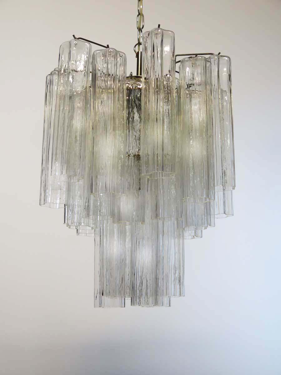 Pair Italian vintage chandelier in Murano glass and nickel-plated metal structure. The armor polished nickel supports 30 large clear glass tubes in a star shape.
Period: 1960s
Dimensions: 47.25 inches (120 cm) height with chain, 24.80 inches (63 cm)