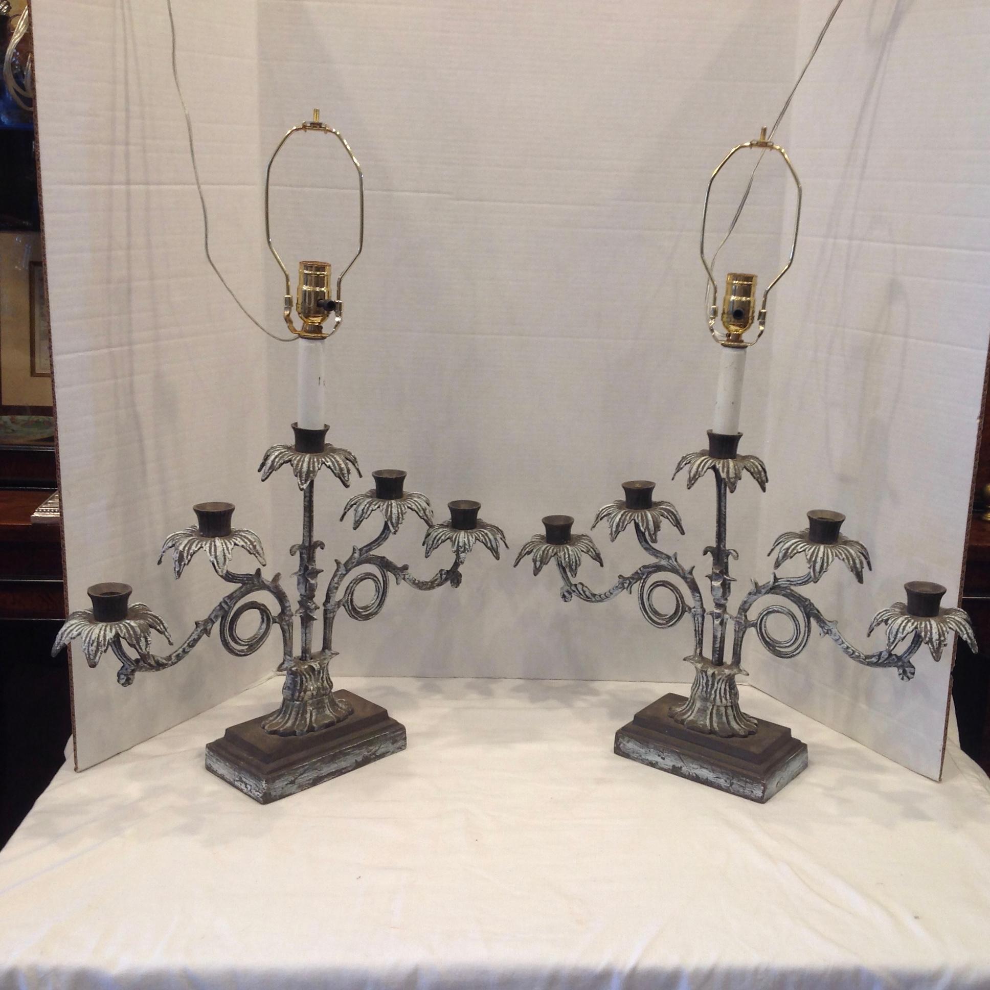 Cast fro iron with five branch like arms. Formerly candelabra - now electrified.
Dramatic style. Lamps are measured to top of socket.