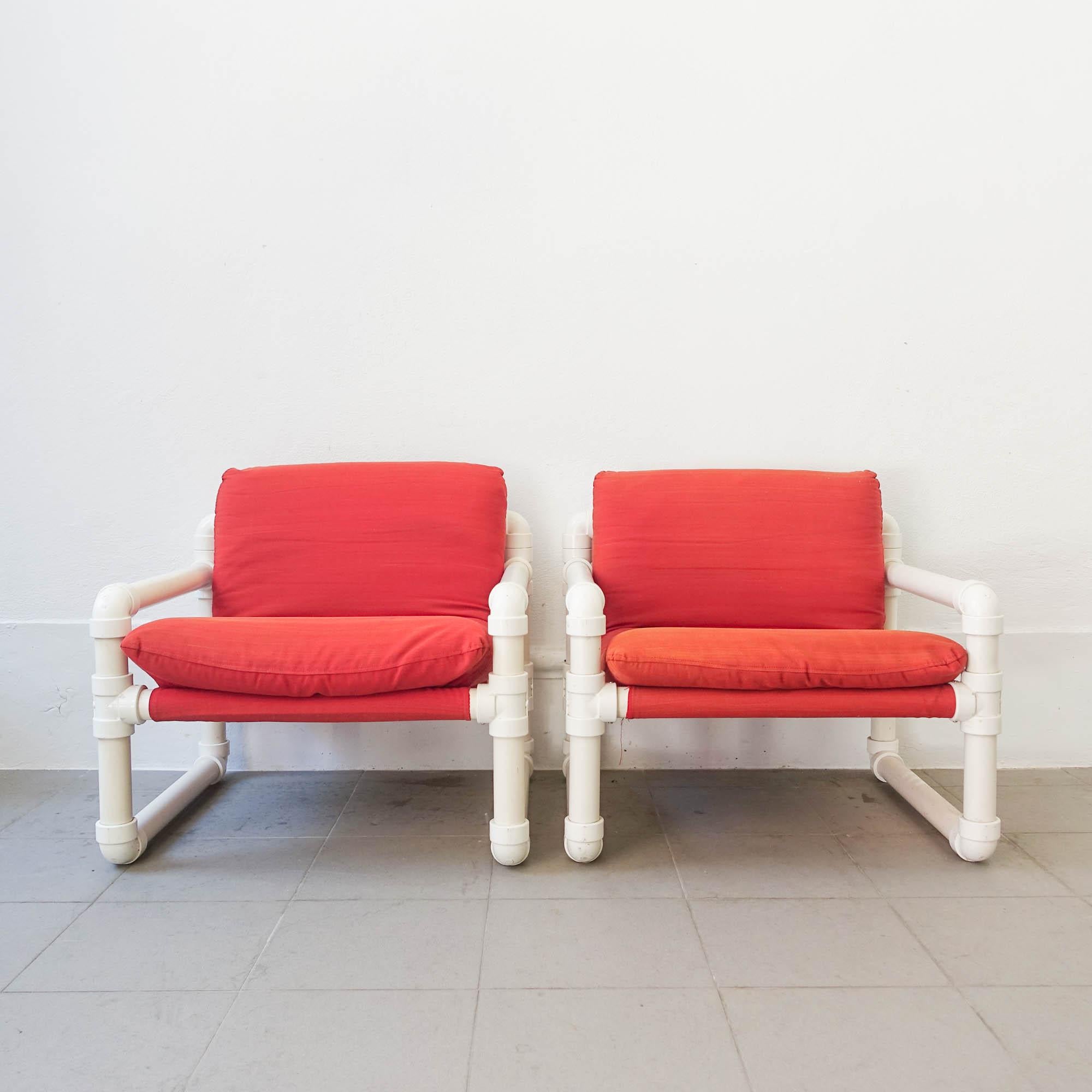 This pair of armchairs, model Tub-Kit, was designed by João Américo Pinto de Oliveira for Altamira and Plimat - Marinha Grande, in Portugal in 1984. It is a unique design were the structure in made of plastic tubes. The seat and back is a continuous